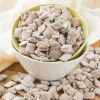 Muddy Buddies ~ crunchy cereal coated with chocolate, peanut butter and powered sugar. This is one kid approved snack and the best news is it takes minutes to throw together!