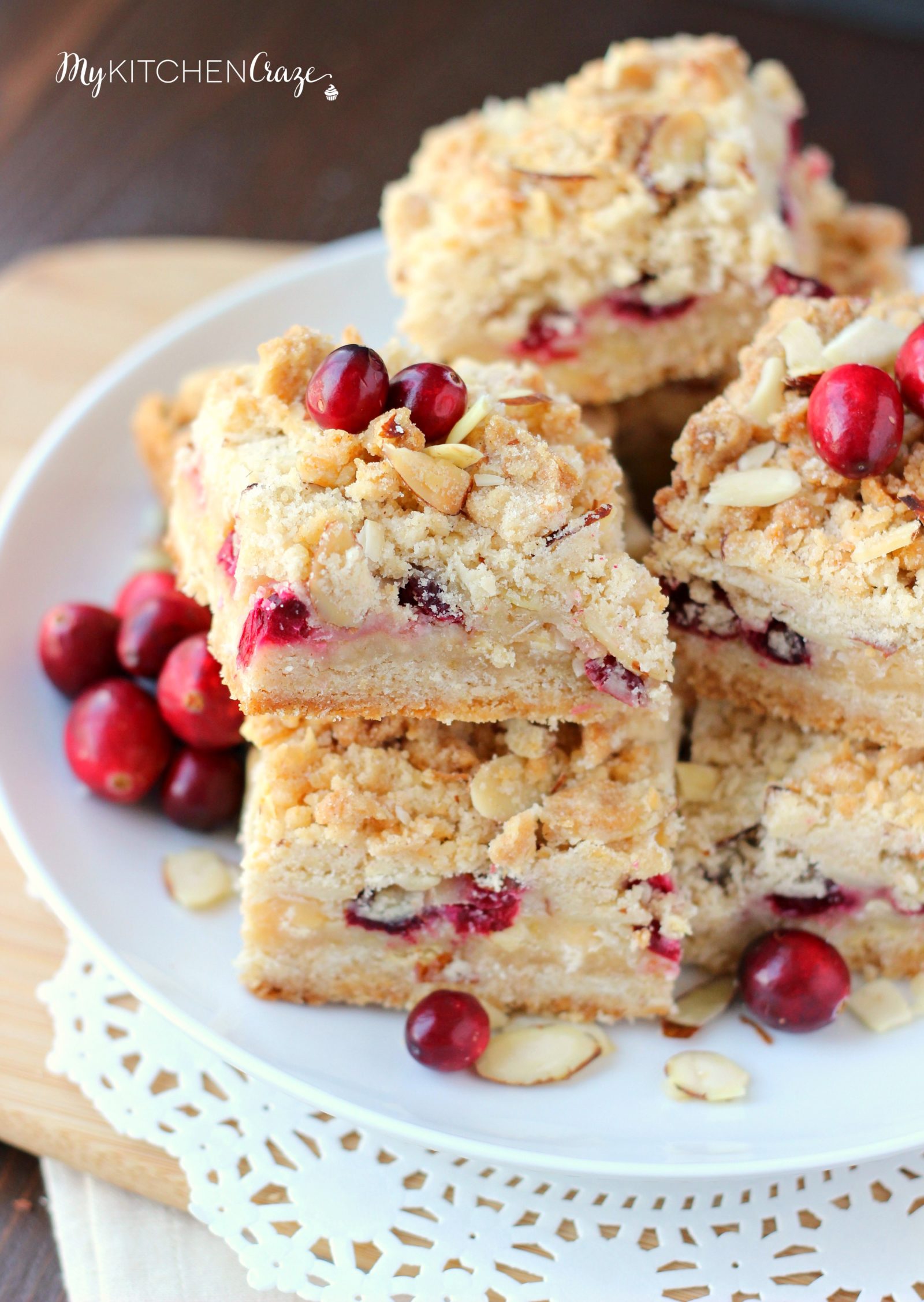 Cranberry Magic Bars ~ mykitchencraze.com ~ A twist on the classic magic bars. These have layers of white chocolate chips, flakey coconut, condensed milk and fresh cranberries. These magic bars will be gone before you know it!