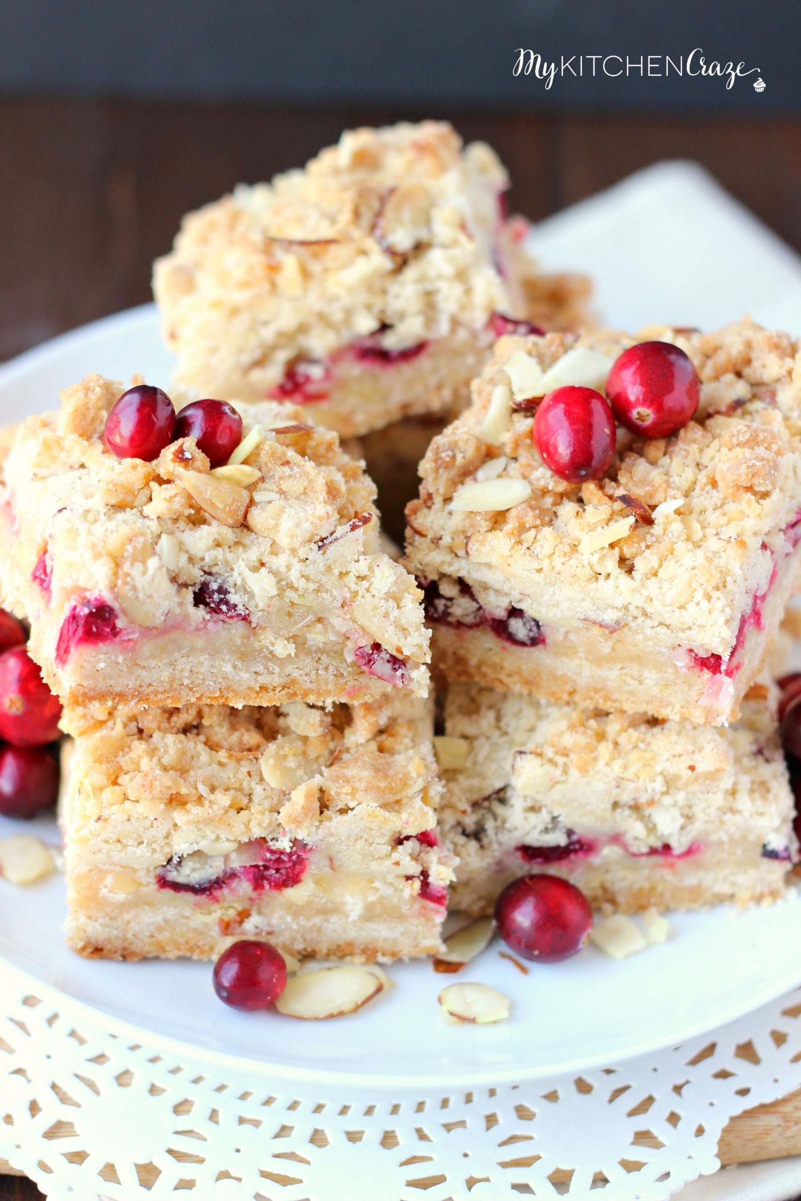 Cranberry Magic Bars ~ mykitchencraze.com ~ A twist on the classic magic bars. These have layers of white chocolate chips, flakey coconut, condensed milk and fresh cranberries. These magic bars will be gone before you know it!