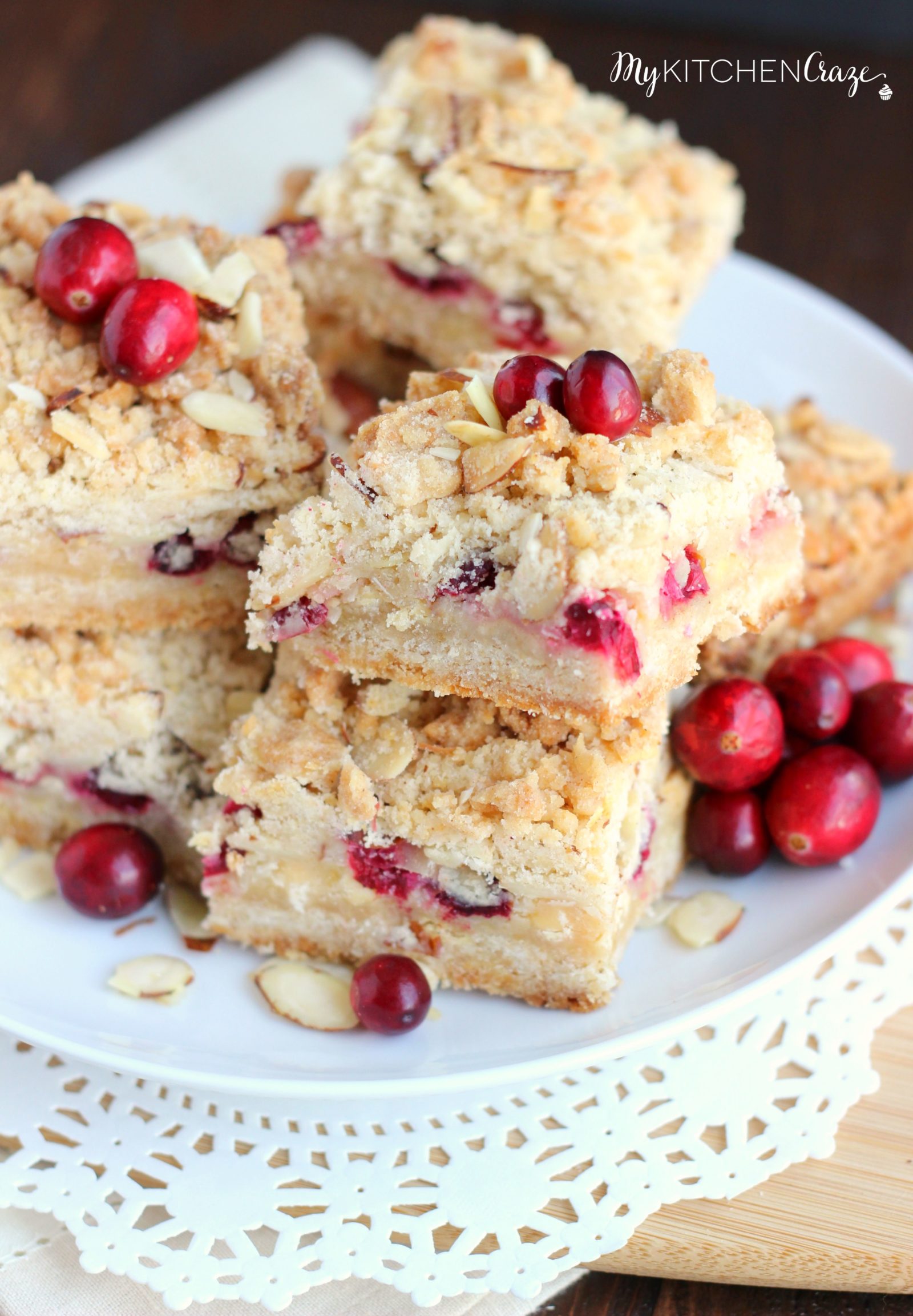 Cranberry Magic Bars ~ mykitchencraze.com ~ A twist on the classic magic bars. These have layers of white chocolate chips, flakey coconut, condensed milk and fresh cranberries. These magic bars will be gone before you know it!