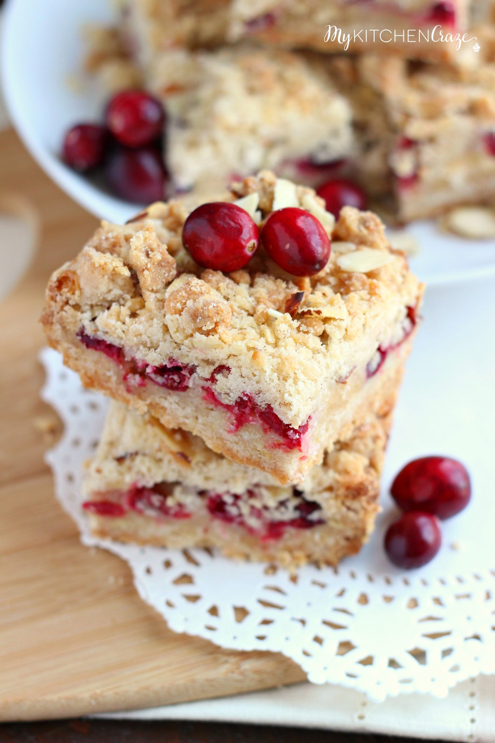 Cranberry Magic Bars ~ mykitchencraze.com ~ A twist on the classic magic bars. These have layers of white chocolate chips, flakey coconut, condensed milk and fresh cranberries. These magic bars will be gone before you know it!