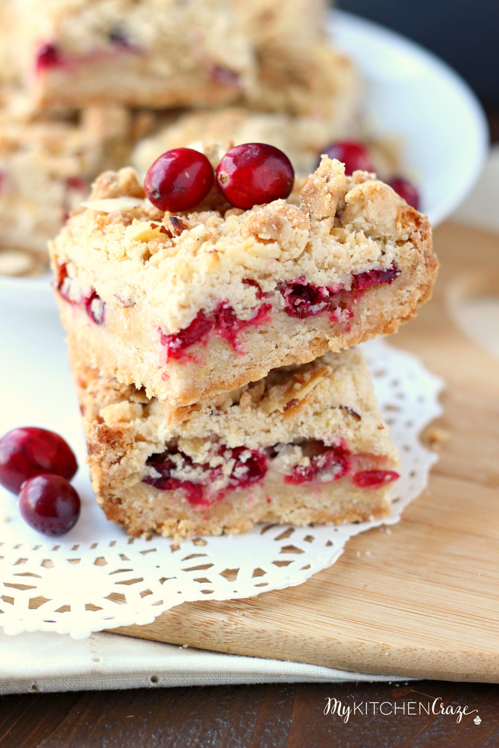 Cranberry Magic Bars ~ mykitchencraze.com ~ A twist on the classic magic bars. These have layers of white chocolate chips, flakey coconut, condensed milk and fresh cranberries. These magic bars will be gone before you know it!