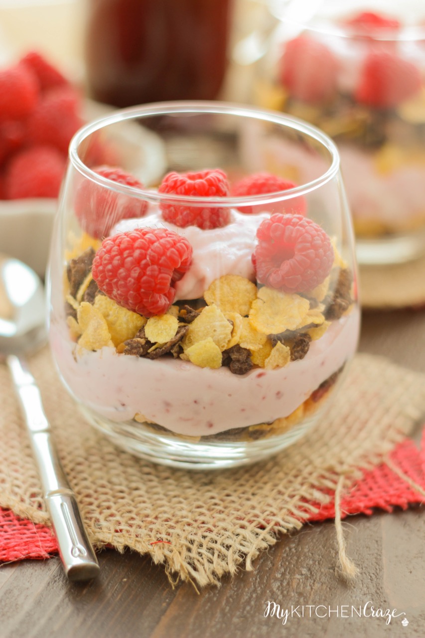 Raspberry Chocolate Crunch Parfaits ~ mykitchencraze.com ~ A delicious breakfast for those busy mornings. Greek yogurt layered with Honey Bunches of Oats Chocolate cereal and topped with fresh raspberries. Perfect combo!