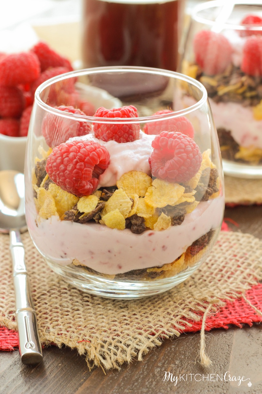 Raspberry Chocolate Crunch Parfaits ~ mykitchencraze.com ~ A delicious breakfast for those busy mornings. Greek yogurt layered with Honey Bunches of Oats Chocolate cereal and topped with fresh raspberries. Perfect combo!