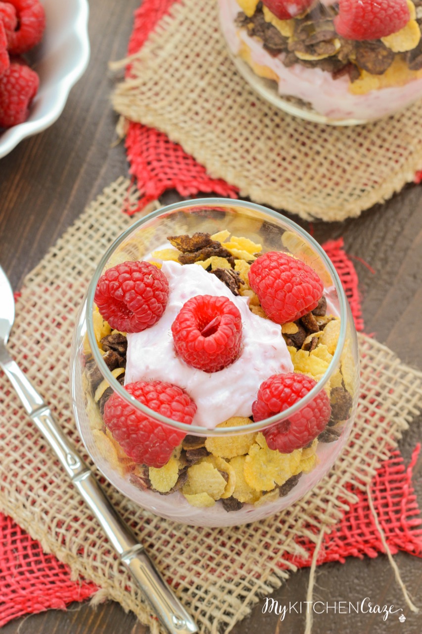 Raspberry Chocolate Crunch Parfaits ~ mykitchencraze.com ~ A delicious breakfast for those busy mornings. Greek yogurt layered with Honey Bunches of Oats Chocolate cereal and topped with fresh raspberries. Perfect combo!