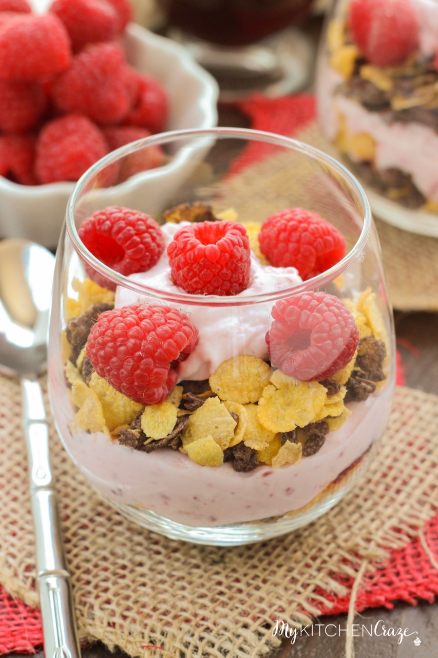 Raspberry Chocolate Crunch Parfaits ~ mykitchencraze.com ~ A delicious breakfast for those busy mornings. Greek yogurt layered with Honey Bunches of Oats Chocolate cereal and topped with fresh raspberries. Perfect combo!