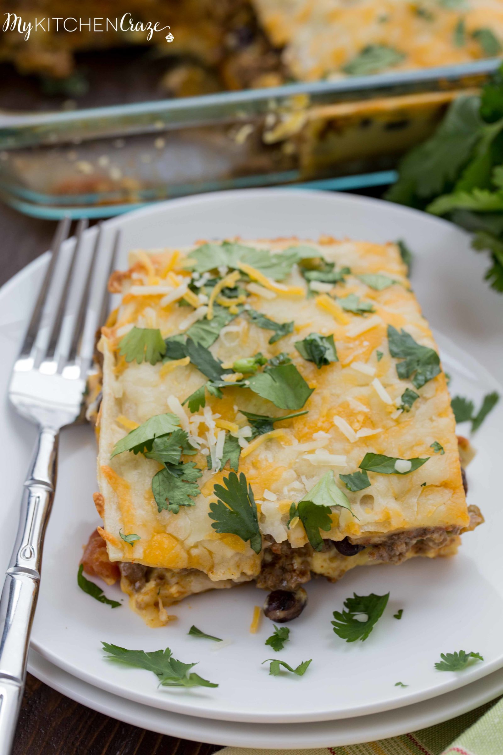 Cheesy Burrito Casserole ~ mykitchencraze.com ~ Enjoy this 30 minute meal on those busy nights. Loaded with all sorts of veggies, ground beef and a delicious sauce. You won't have any leftovers!