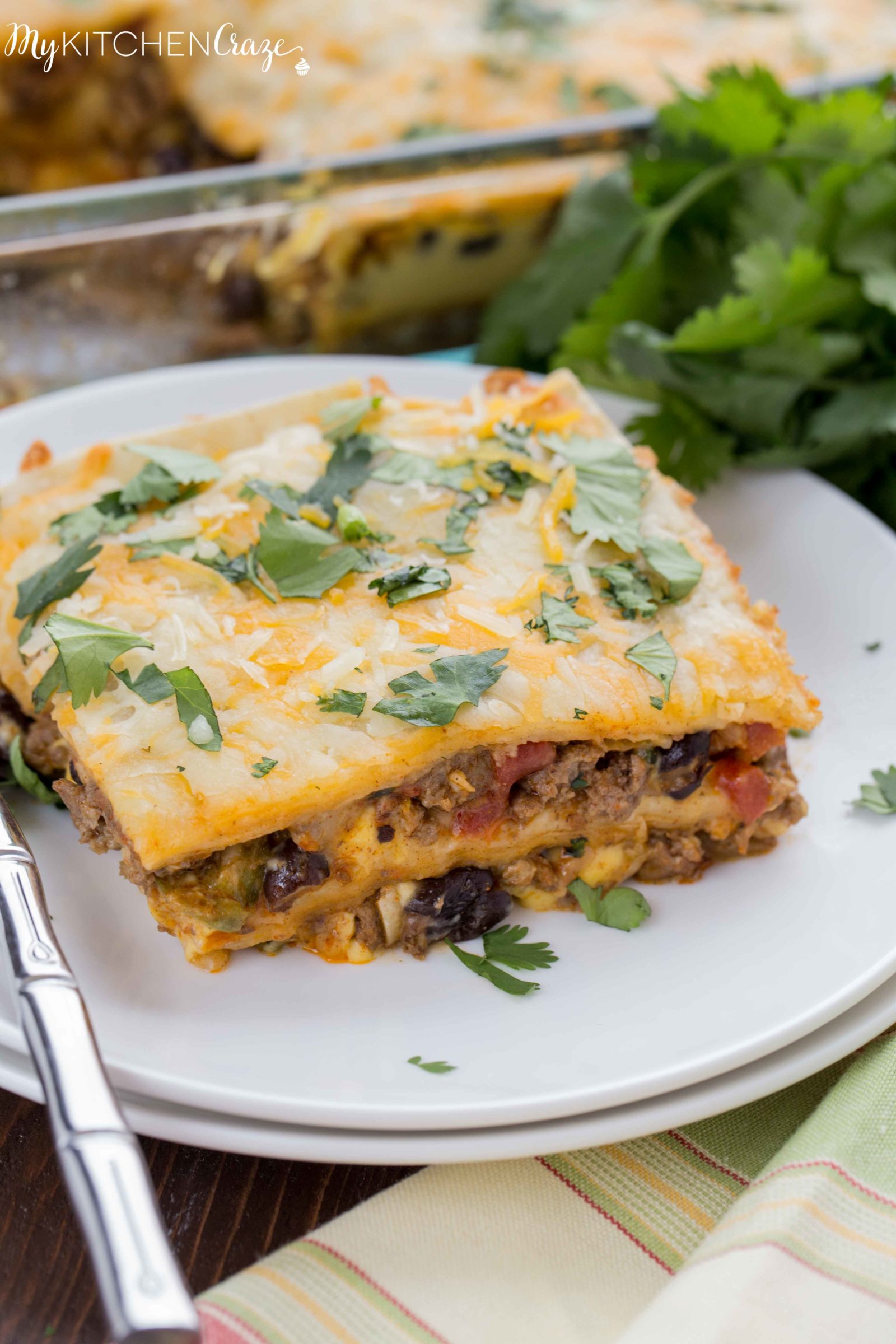 Cheesy Burrito Casserole ~ mykitchencraze.com ~ Enjoy this 30 minute meal on those busy nights. Loaded with all sorts of veggies, ground beef and a delicious sauce. You won't have any leftovers!