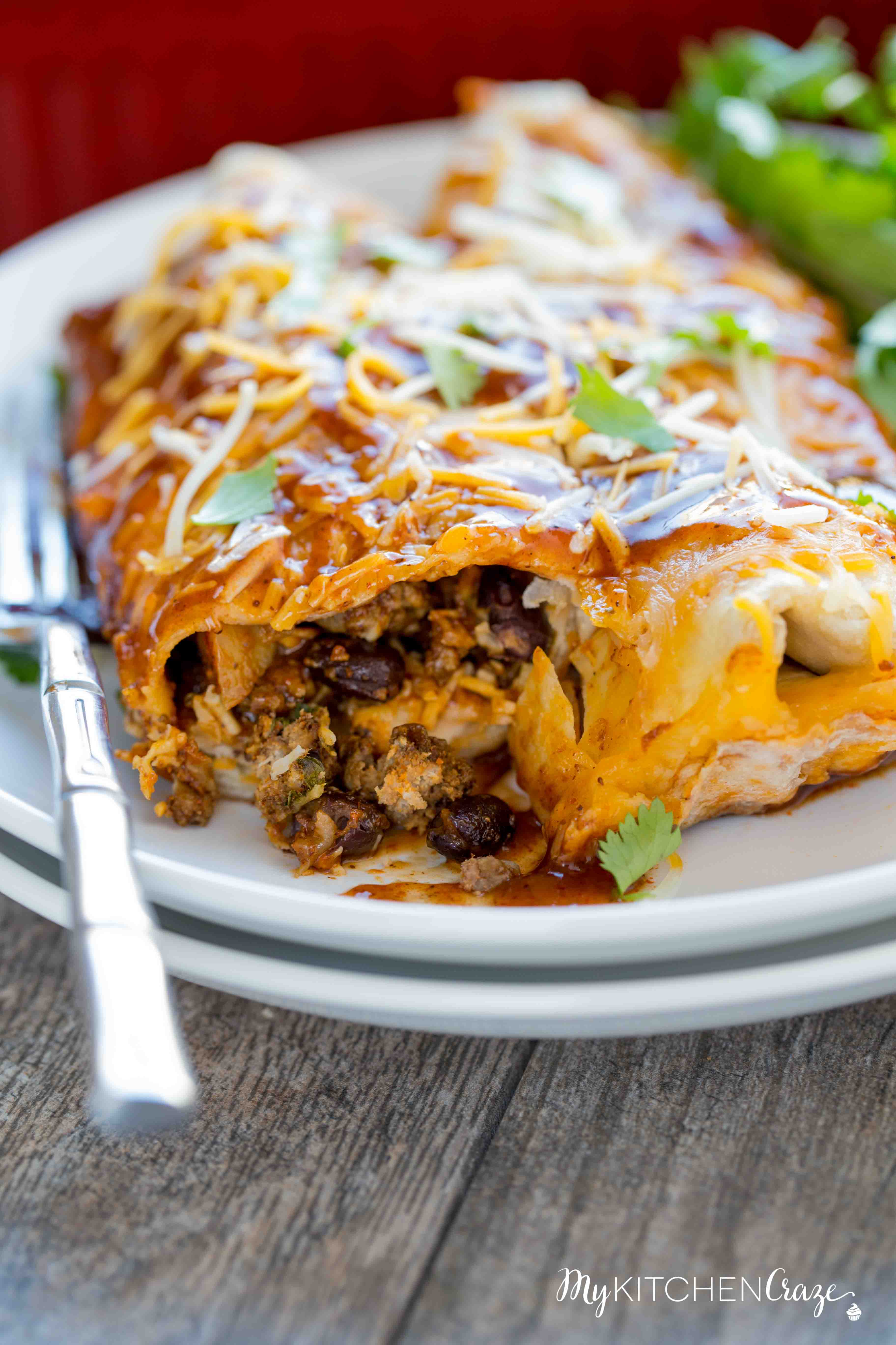 Beef & Potato Enchiladas ~ Loaded with delicious ground beef, crispy potatoes, vegetables then layered in a yummy enchilada sauce! The Perfect Weeknight Easy Dinner Recipe!