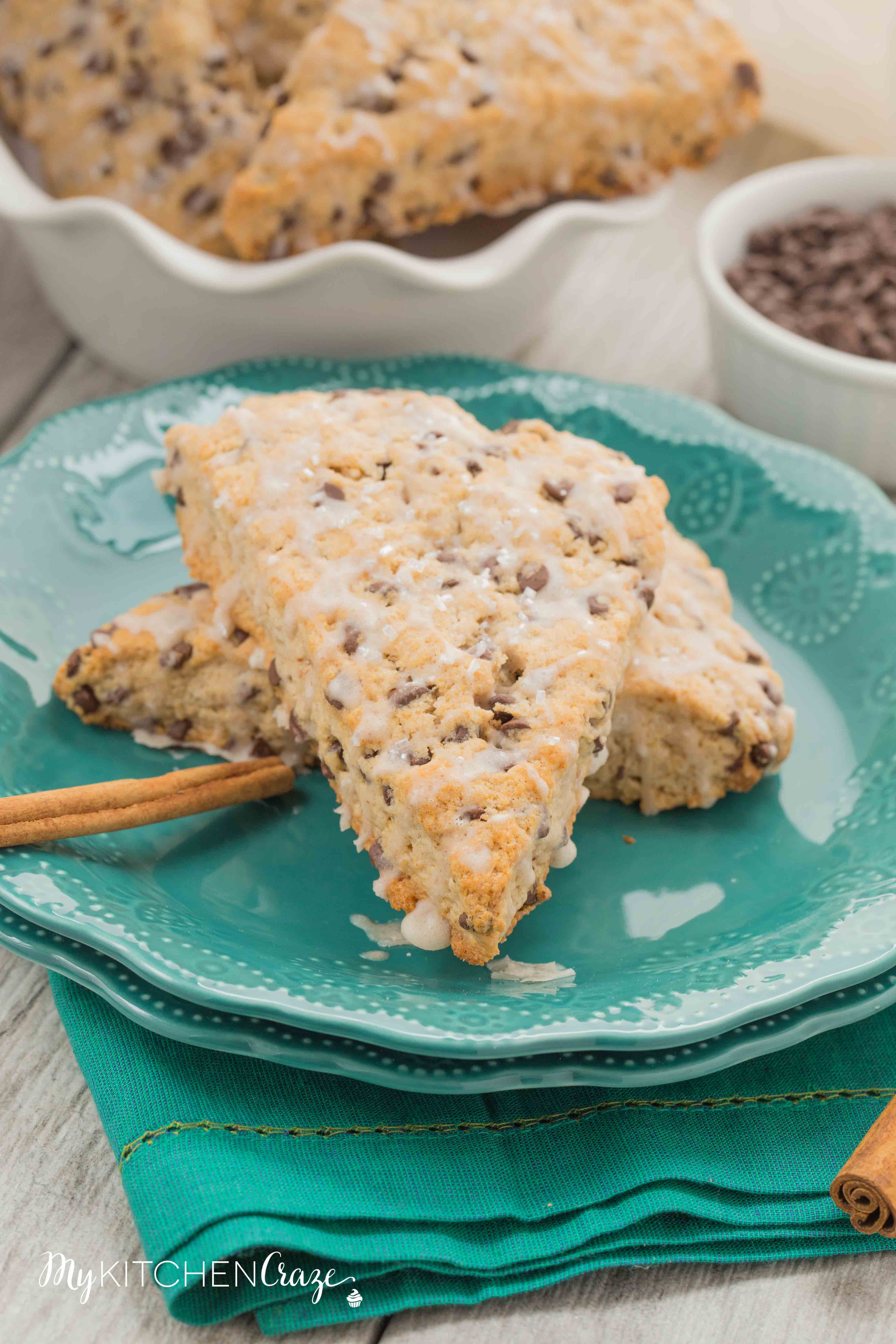 Cinnamon Chocolate Chip Scones ~ mykitchencraze.com ~ These scones are packed with chocolate chips and topped with a cinnamon glaze. These are the most delicious scones e-v-e-r! Moist, crumbly and irresistible. Give them a try.
