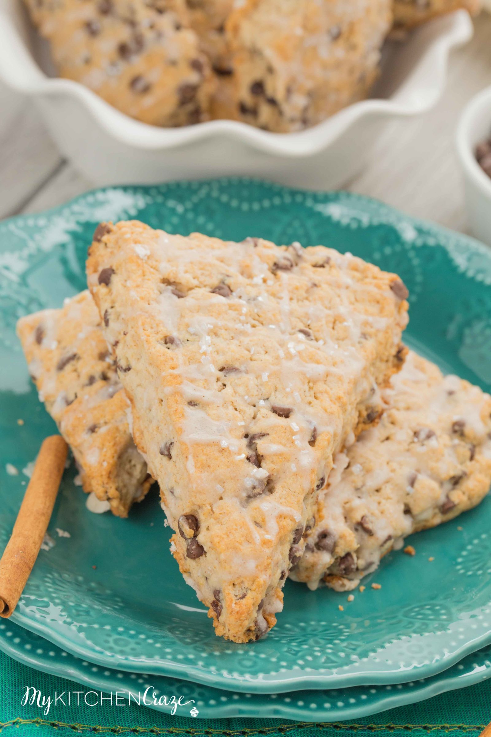 Cinnamon Chocolate Chip Scones ~ mykitchencraze.com ~ These scones are packed with chocolate chips and topped with a cinnamon glaze. These are the most delicious scones e-v-e-r! Moist, crumbly and irresistible. Give them a try.