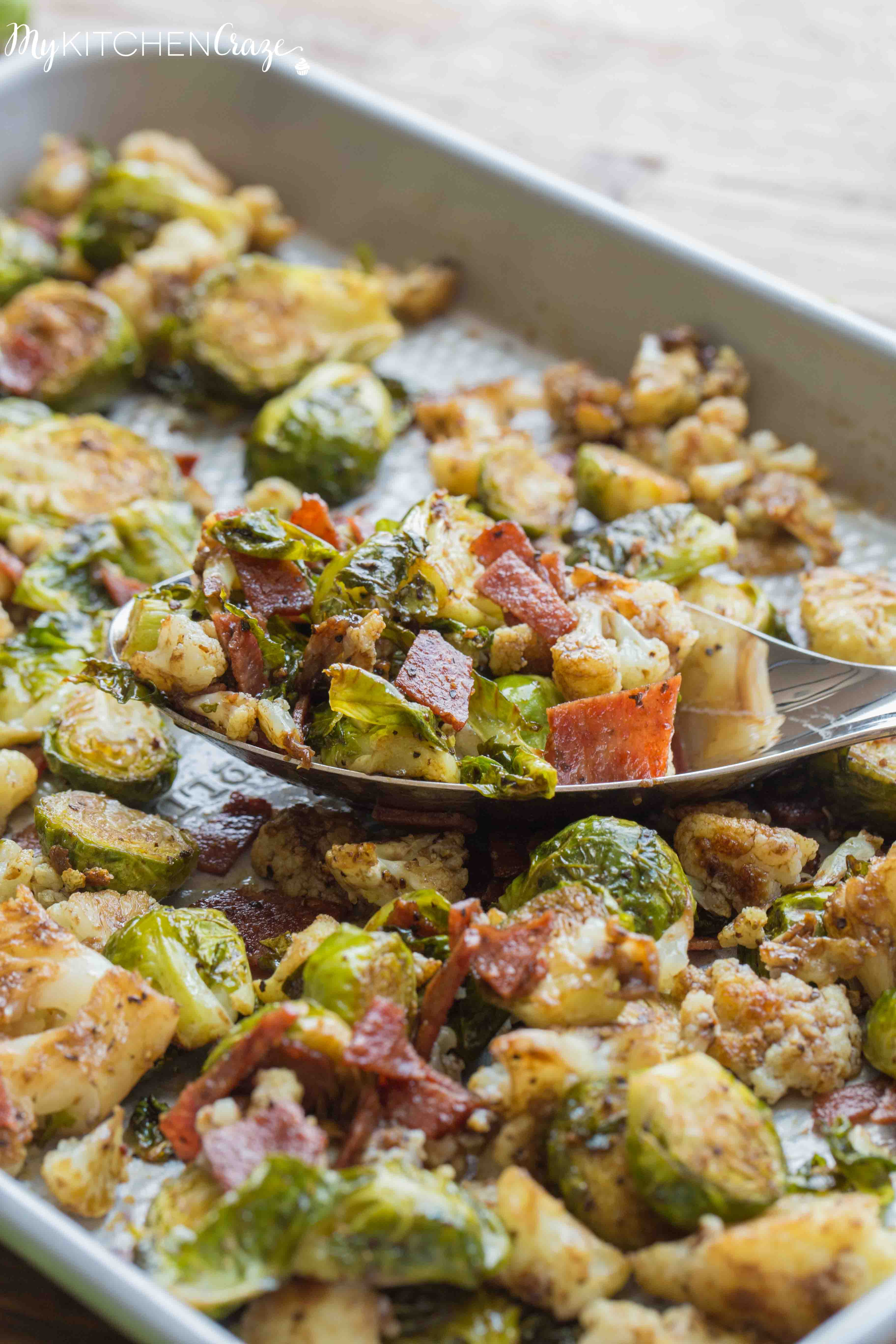 Roasted Brussel Sprouts with Bacon & Cauliflower ~ mykitchencraze.com ~ A delicious side dish loaded with roasted Brussel Sprouts and cauliflower, crispy bacon. Then topped with a delicious balsamic vinaigrette. It's the perfect side dish for any meat and the kids will love it!