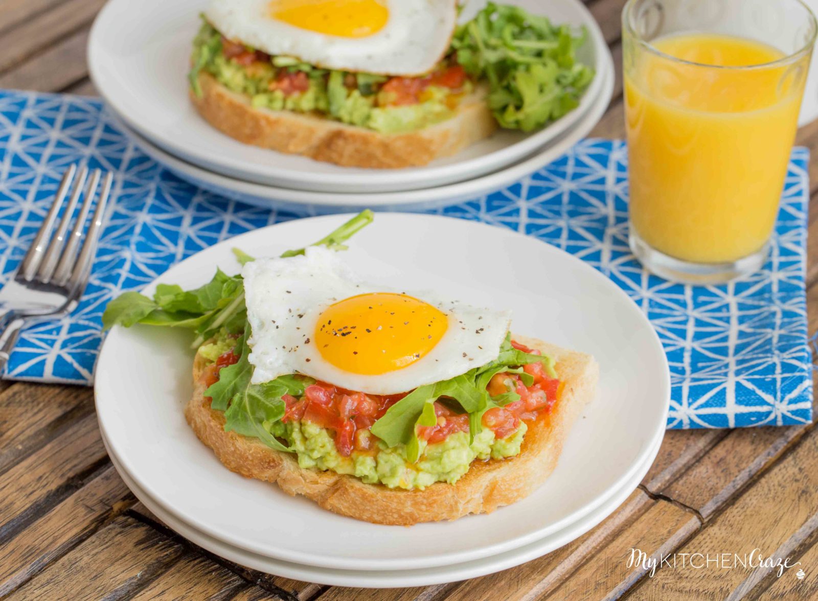 Bruschetta Egg Avocado Toast ~ mykitchencraze.com ~ Sourdough toast loaded with avocado, bruschetta and arugula, then topped with an egg. Perfect way to start your morning!