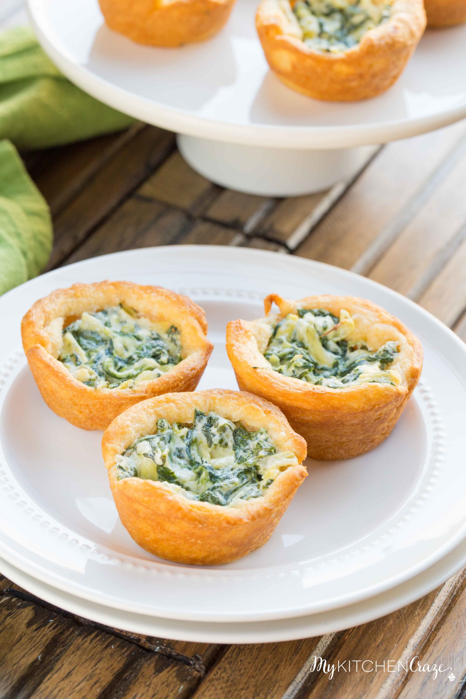 Spinach Artichoke Cups ~ mykitchencraze.com ~ This appetizer is perfect for any potlucks or parties. They take no time at all to make and taste delicious. Your guest won't be able to eat just one!