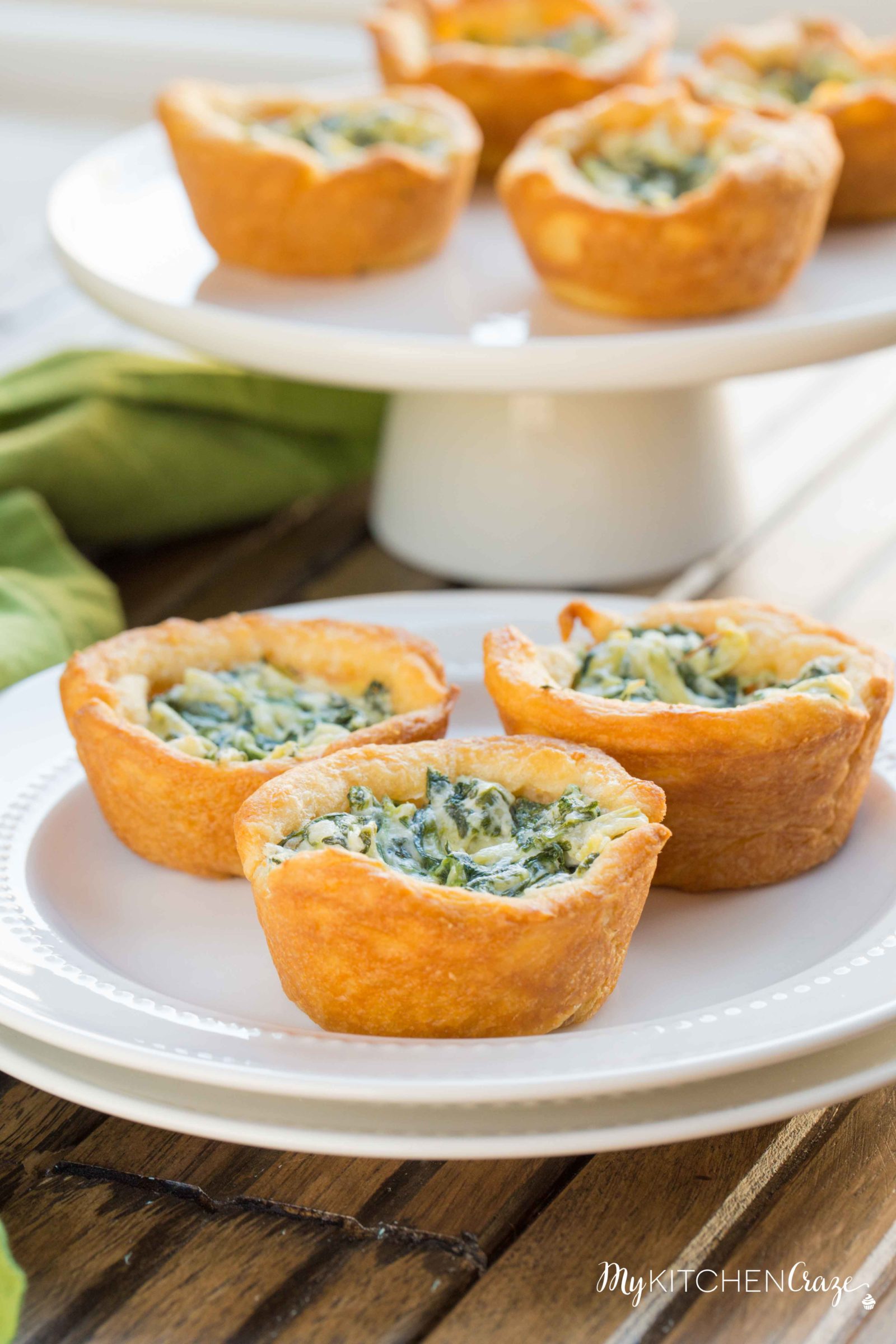 Spinach Artichoke Cups ~ mykitchencraze.com ~ This appetizer is perfect for any potlucks or parties. They take no time at all to make and taste delicious. Your guest won't be able to eat just one!