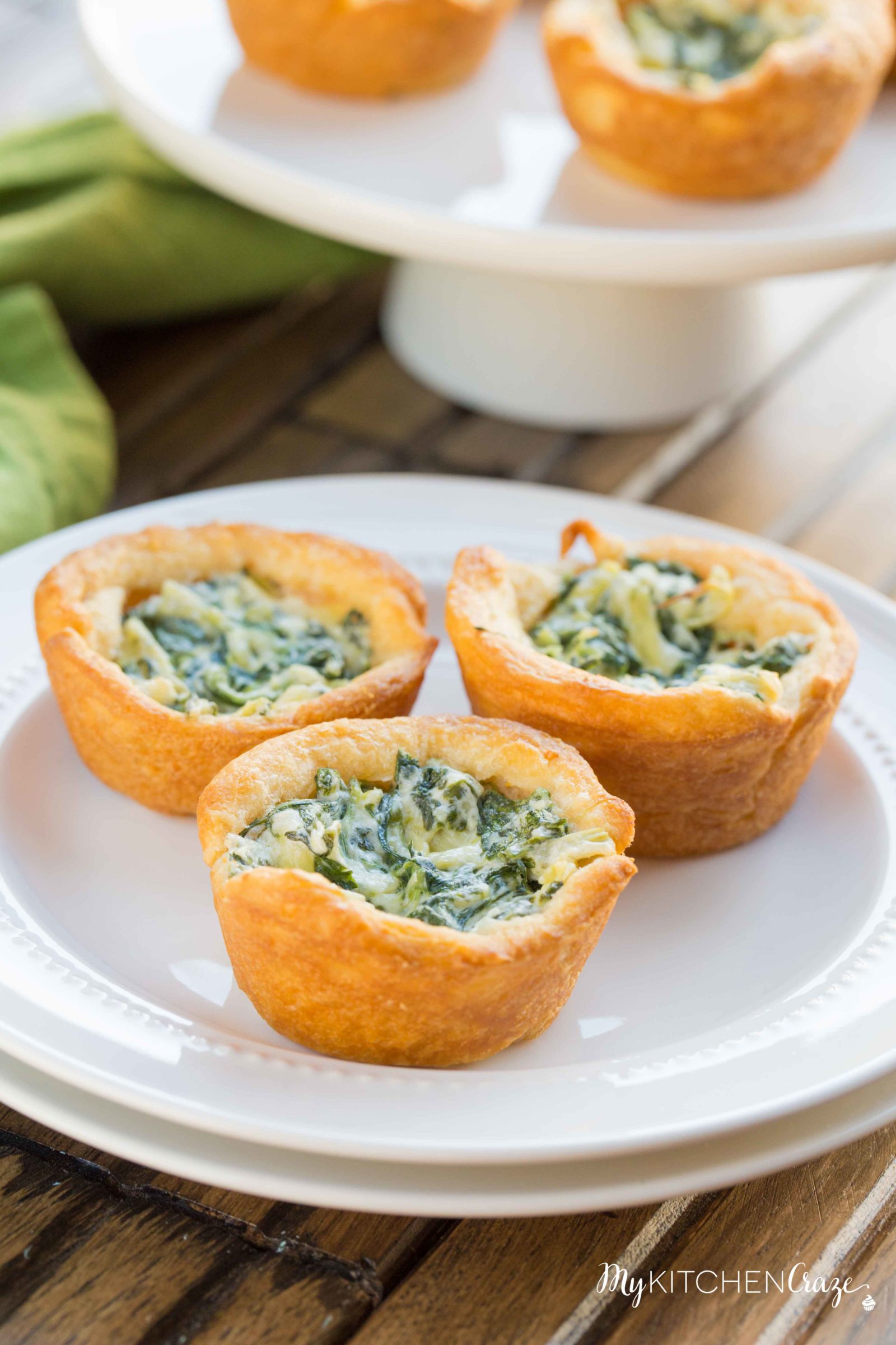 Spinach Artichoke Cups ~ mykitchencraze.com ~ This appetizer is perfect for any potlucks or parties. They take no time at all to make and taste delicious. Your guest won't be able to eat just one!