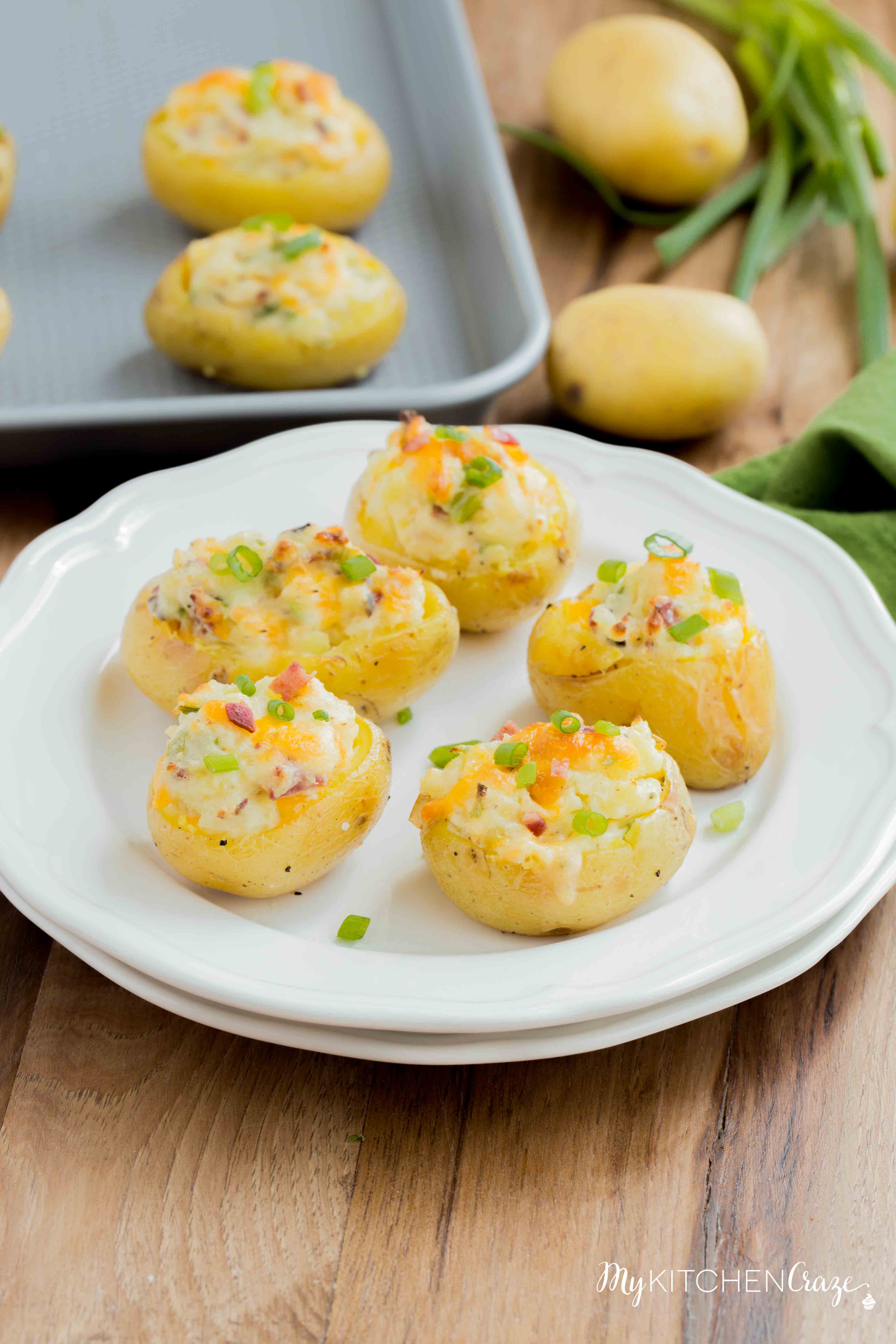 Mini Twice Baked Potatoes ~ Potatoes baked to perfection then loaded with bacon, green onions and cheese. All the yummy things you need for a side! These mini twice baked potatoes are the perfect side.