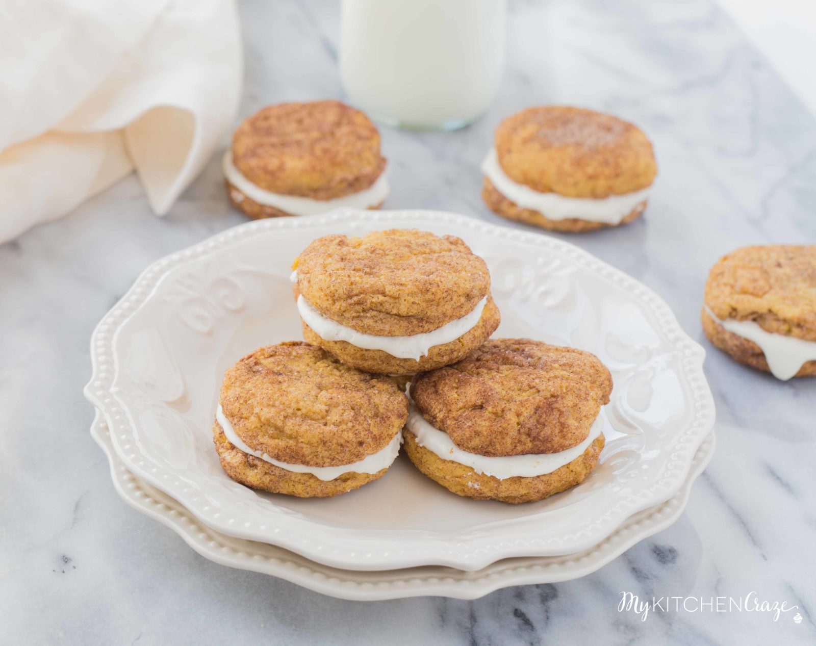 Pumpkin Snickerdoodle Whoopie Pies ~ Moist, delicious cookies filled with marshmallow cream! Perfect for this Fall season!