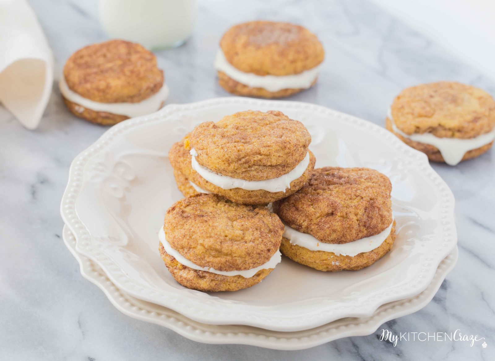 Pumpkin Snickerdoodle Whoopie Pies ~ Moist, delicious cookies filled with marshmallow cream! Perfect for this Fall season!