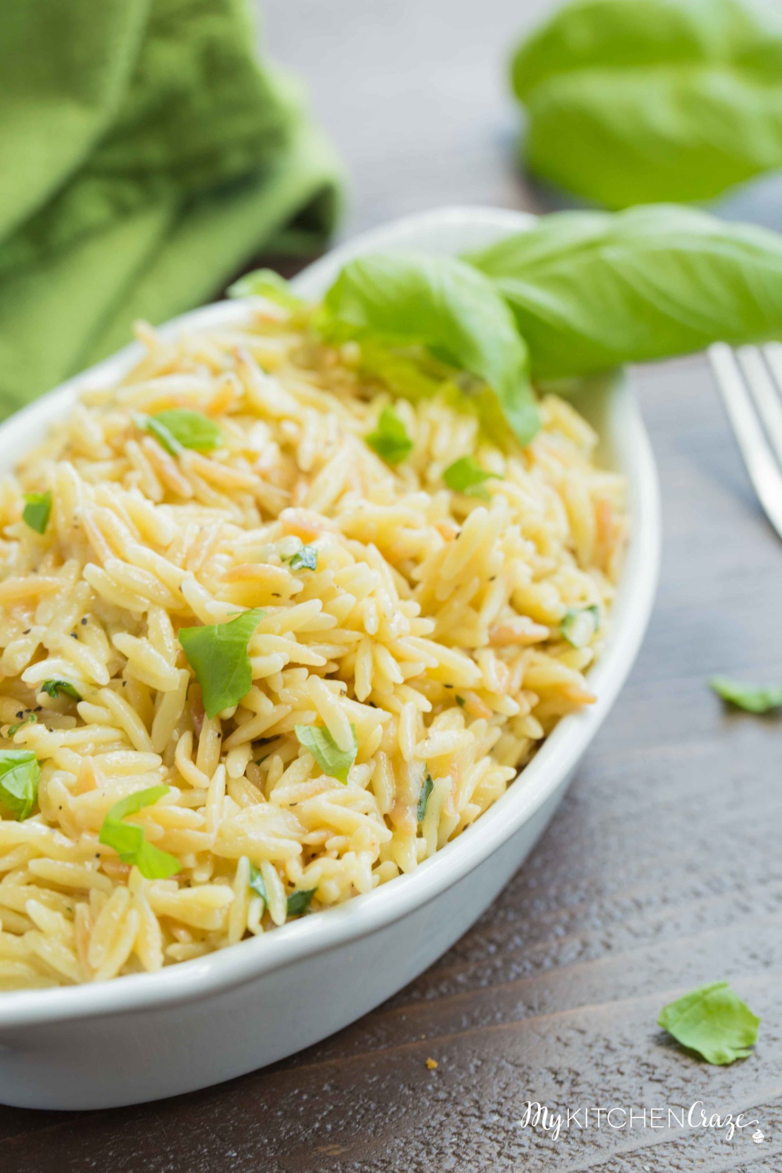 Cheesy Basil Orzo ~ Only 6 ingredients are all you need to make this fresh pasta side recipe. The cheese and basil brighten the dish making it perfect for any main.