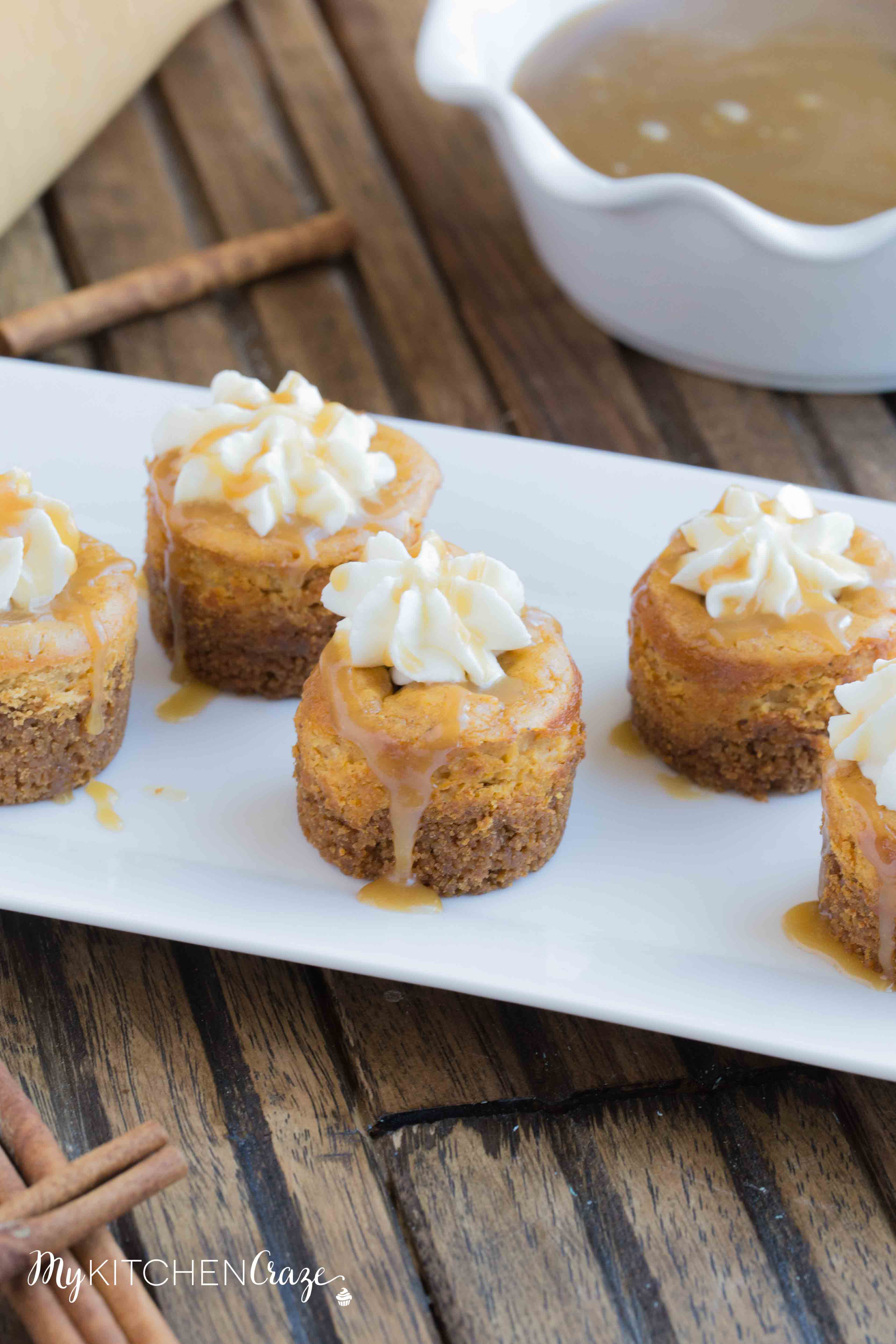 Mini Pumpkin Cheesecakes are the perfect fall dessert! Creamy cheesecake has the perfect hint of pumpkin, topped with homemade whipped cream and caramel sauce. It doesn't get much better than these cute mini cheesecakes this season!