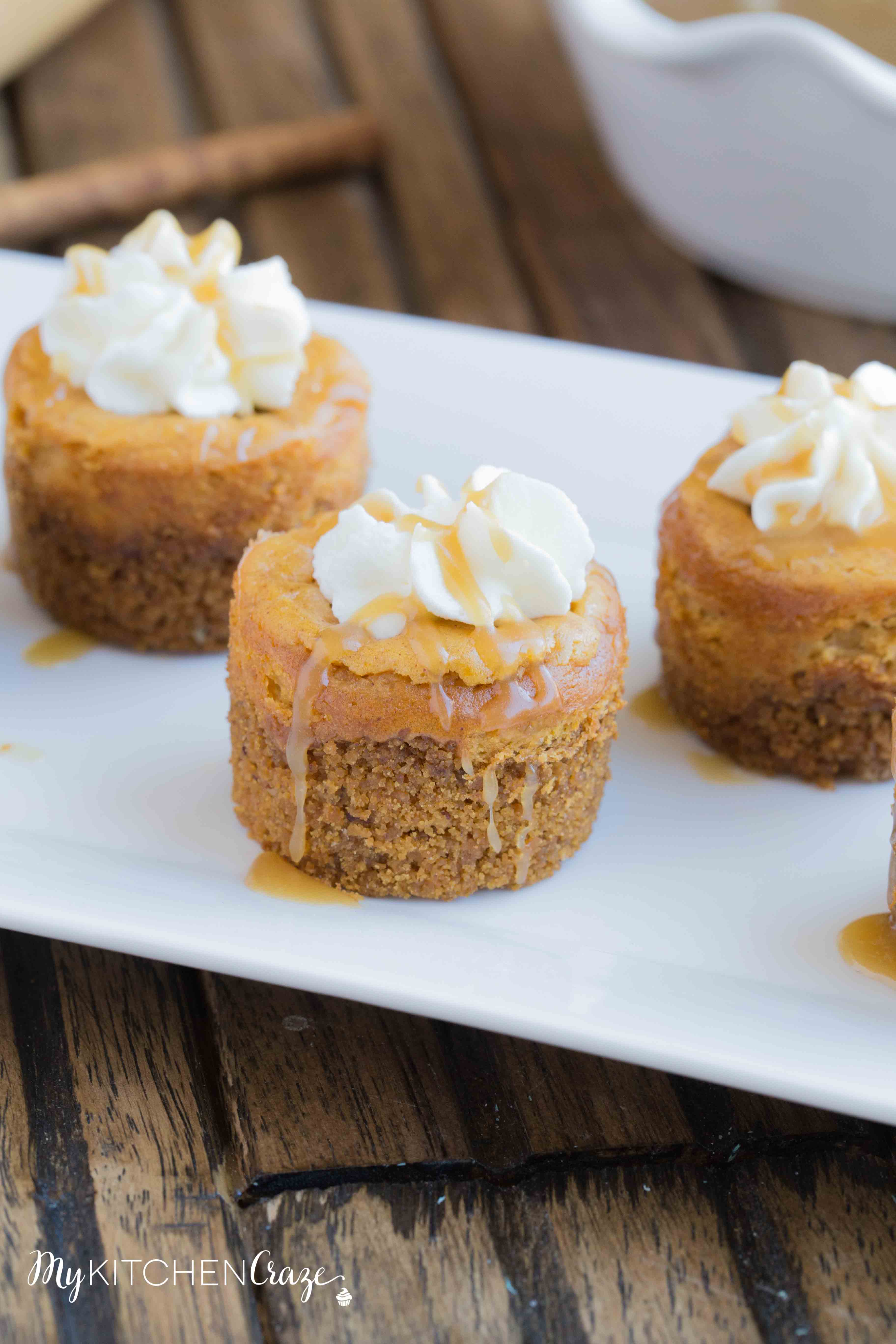 Mini Pumpkin Cheesecakes are the perfect fall dessert! Creamy cheesecake has the perfect hint of pumpkin, topped with homemade whipped cream and caramel sauce. It doesn't get much better than these cute mini cheesecakes this season!