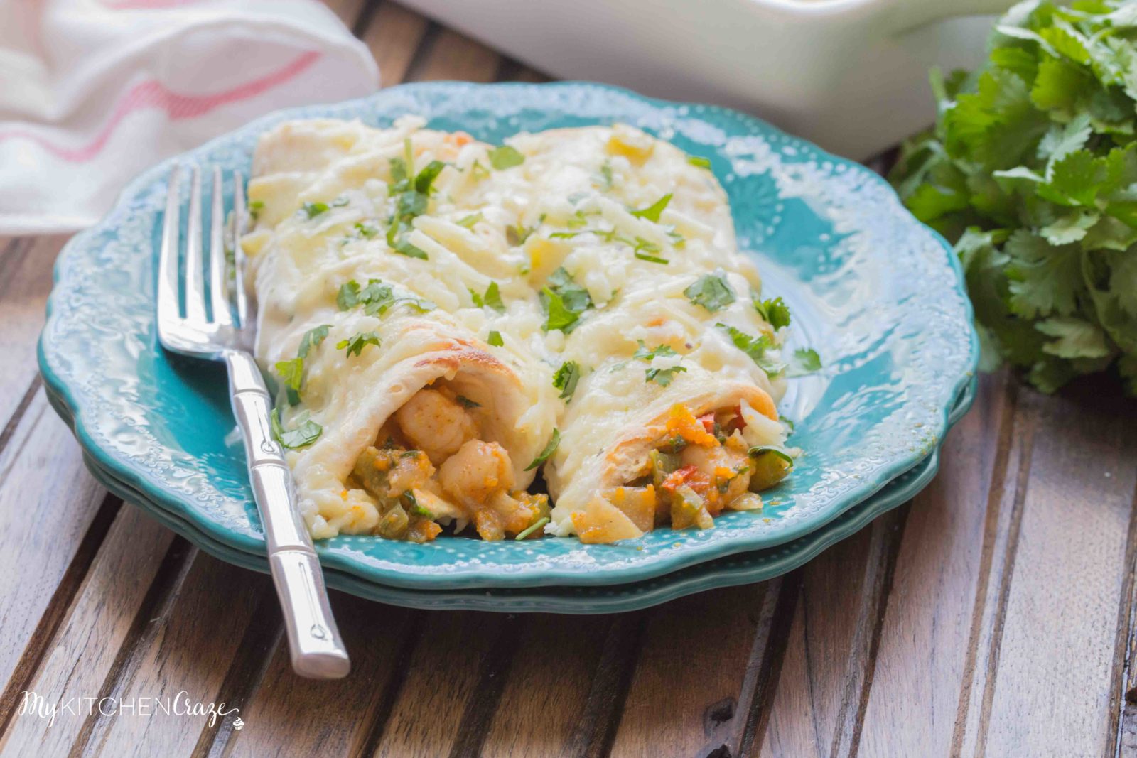 Shrimp Enchiladas ~ Filled with tender, flavorful shrimp then topped with a delicious homemade creamy sauce. You're going to love these enchiladas!