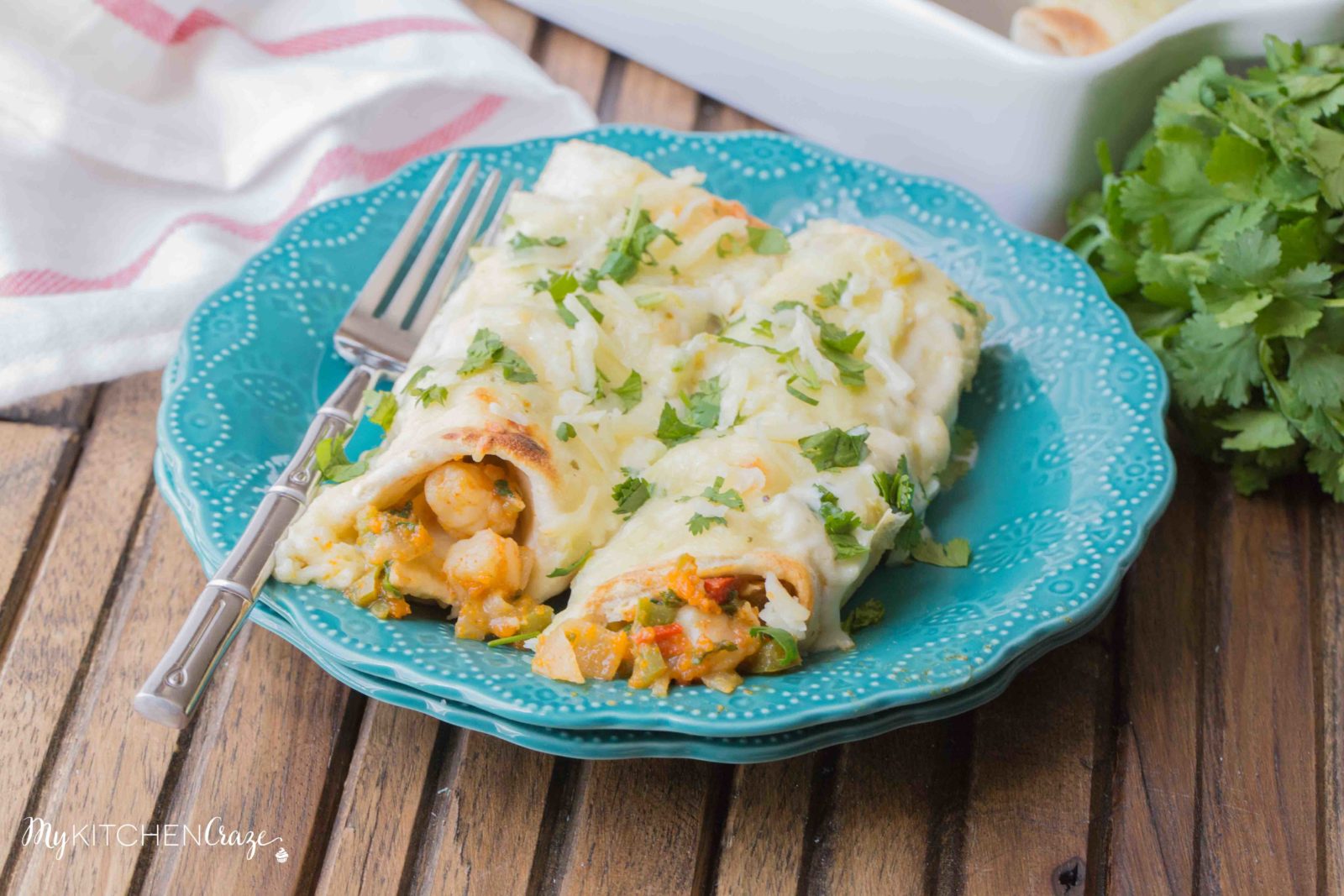 Shrimp Enchiladas ~ Filled with tender, flavorful shrimp then topped with a delicious homemade creamy sauce. You're going to love these enchiladas!