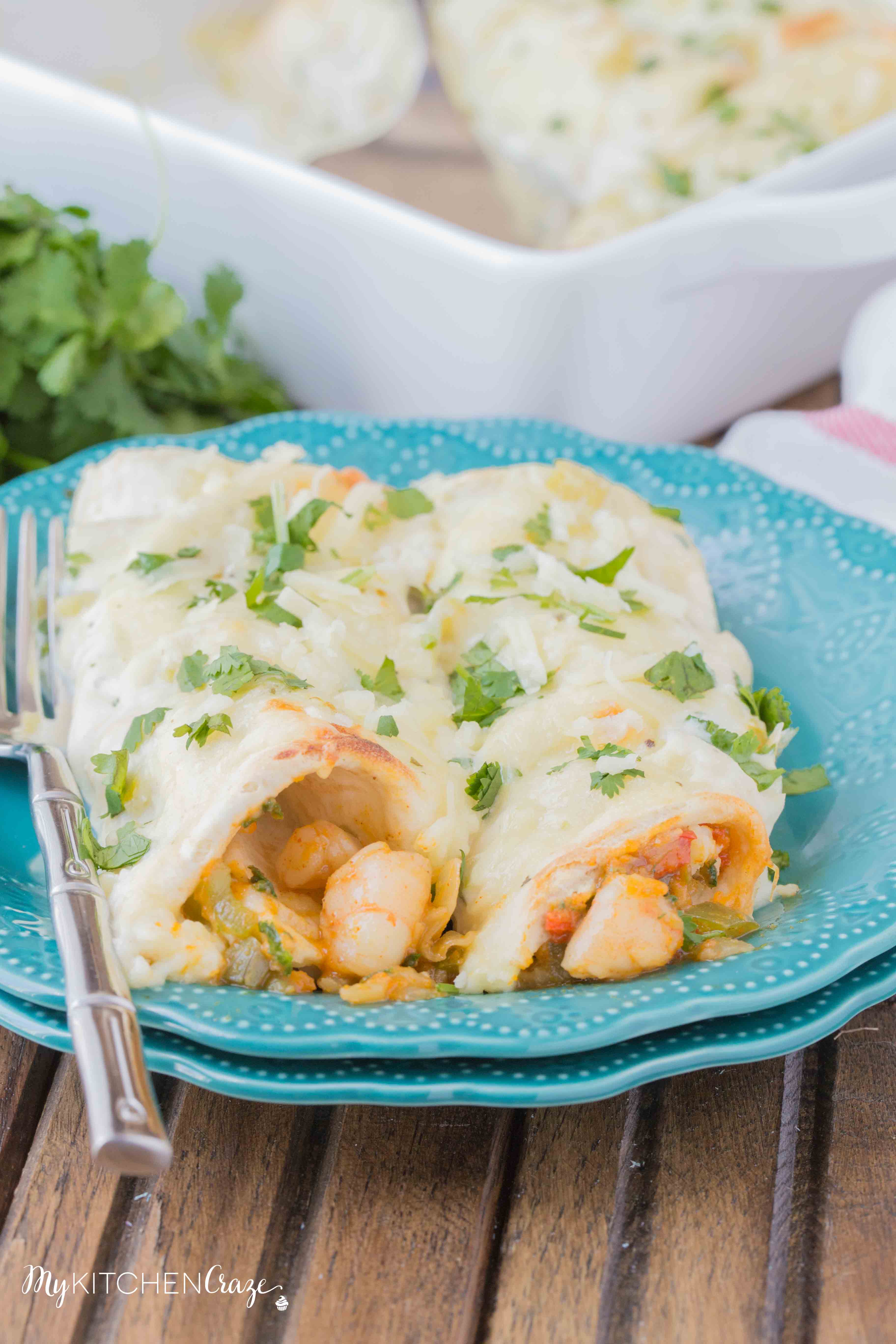 Shrimp Enchiladas ~ Filled with tender, flavorful shrimp then topped with a delicious homemade creamy sauce. You're going to love these enchiladas!