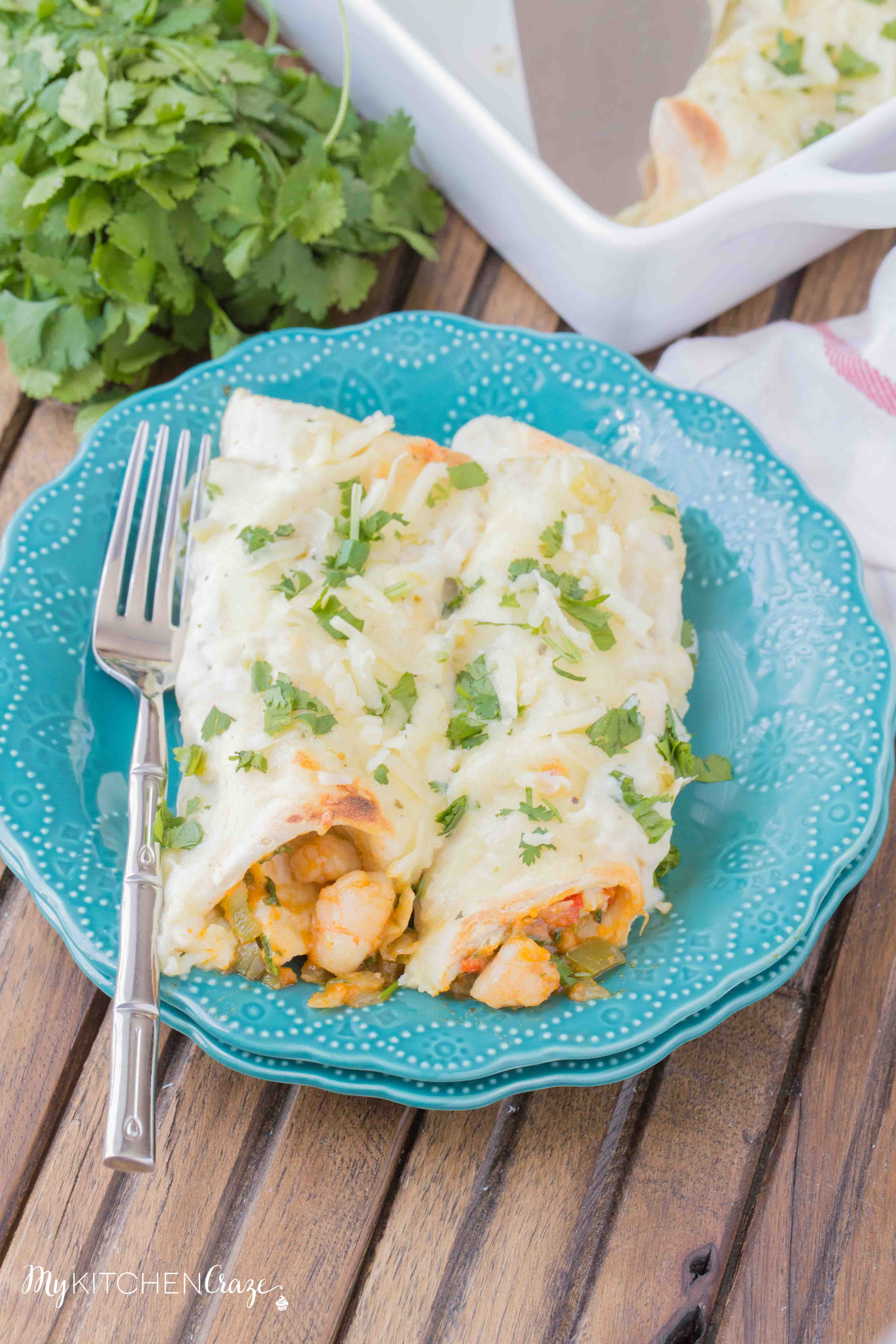 Shrimp Enchiladas ~ Filled with tender, flavorful shrimp then topped with a delicious homemade creamy sauce. You're going to love these enchiladas!