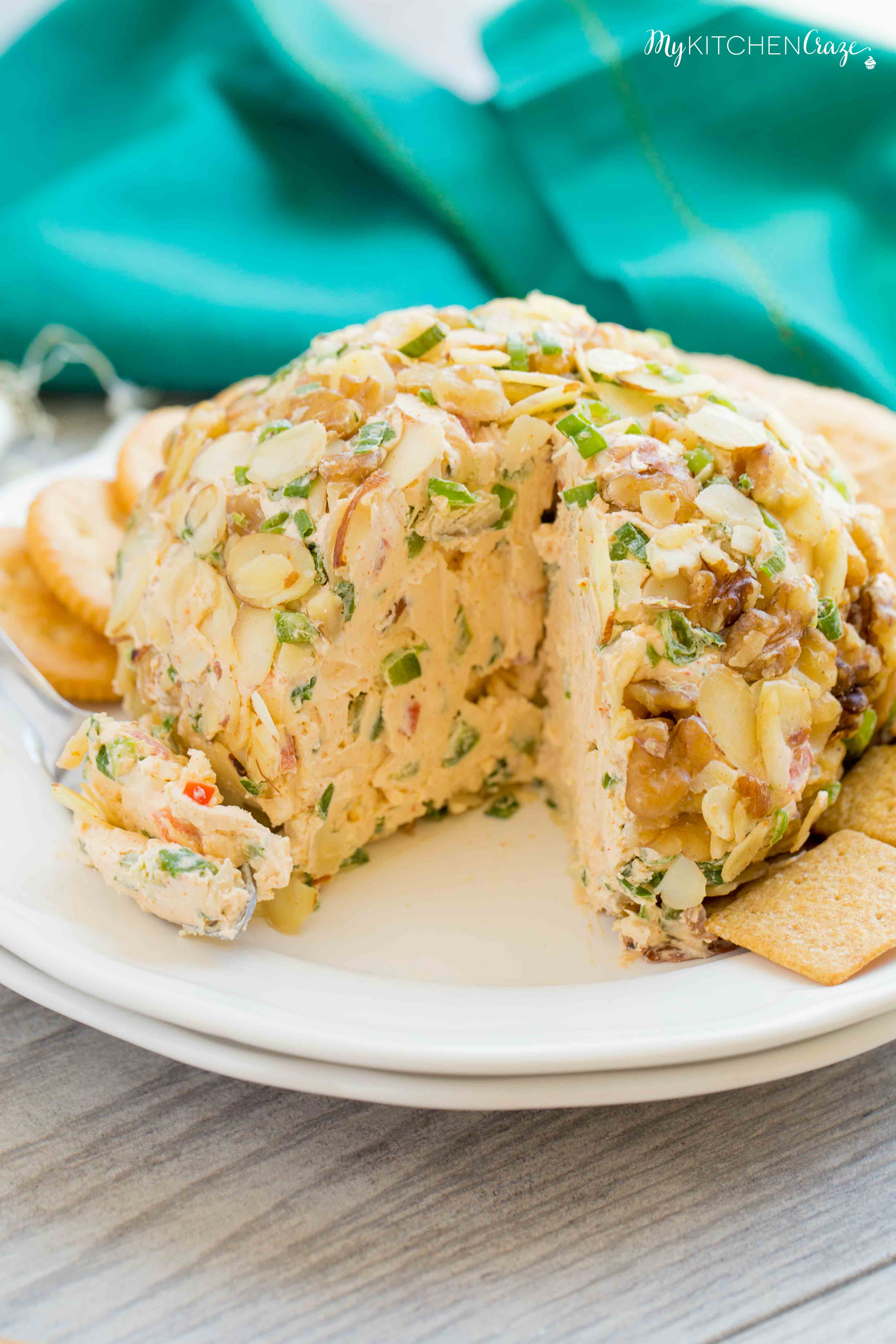 Spicy Cheese Ball ~ Loaded with cream cheese, spices, jalapeños, shredded cheeses & fresh veggies. This is one cheese ball bundled with rich creamy goodness!