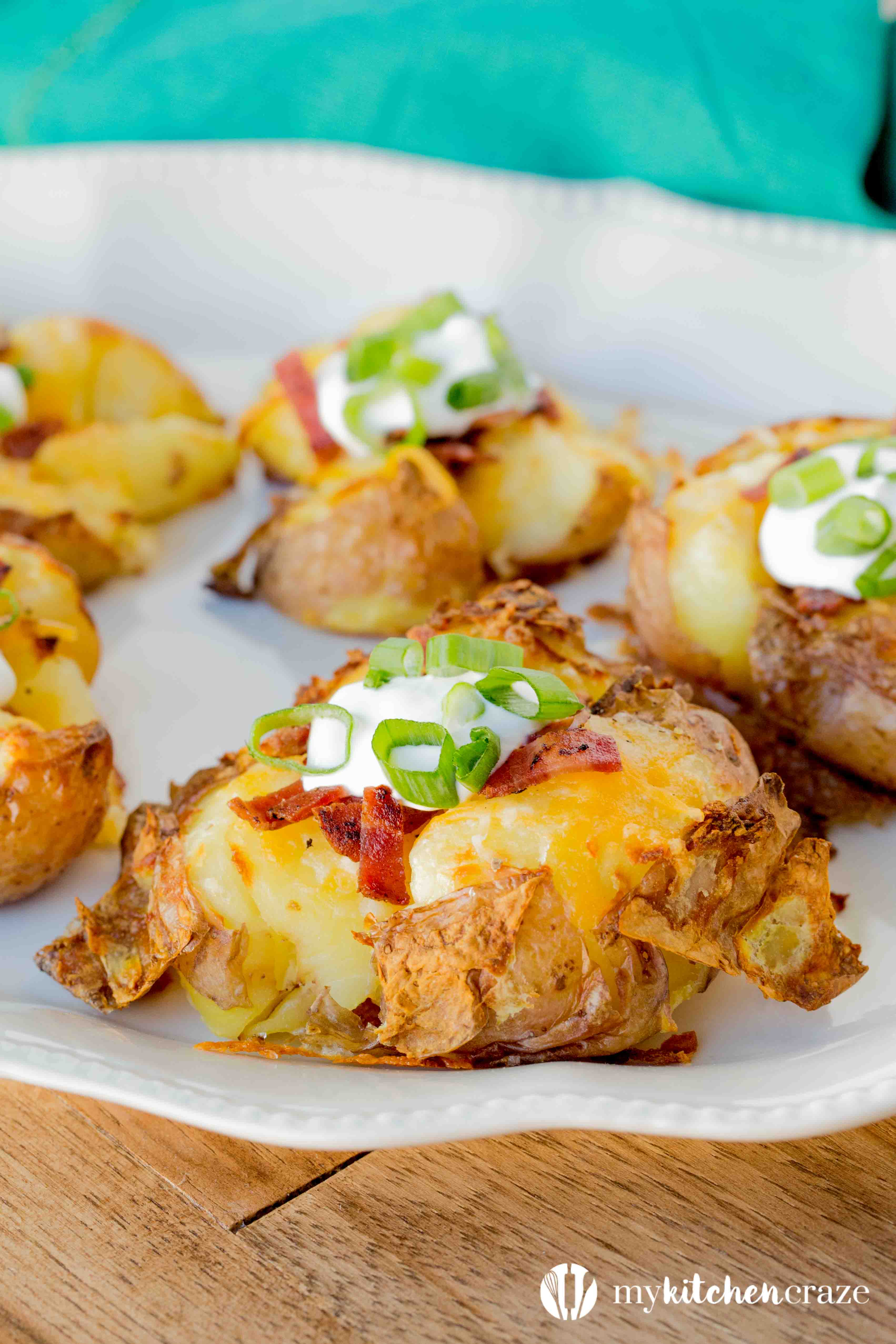 Loaded Smashed Potatoes are a no fuss and delicious side dish. Loaded with all the yummy things you'd find in a loaded baked potato. This is one side everyone will love!