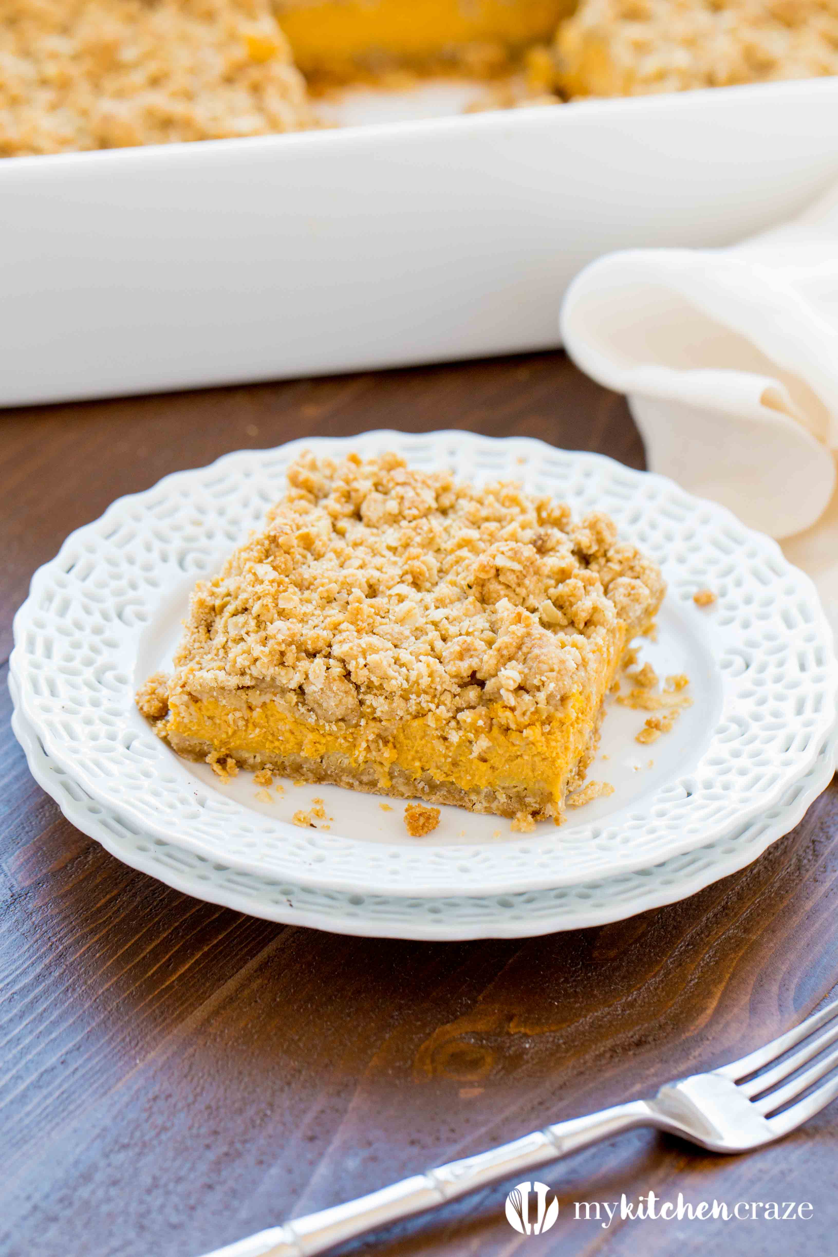 Pumpkin Cheesecake Bars ~ When you combine pumpkin & cheesecake together, what do you get? Delicious PUMPKIN CHEESECAKE BARS! These bars are creamy with a crunchy topping and crust. Yum!