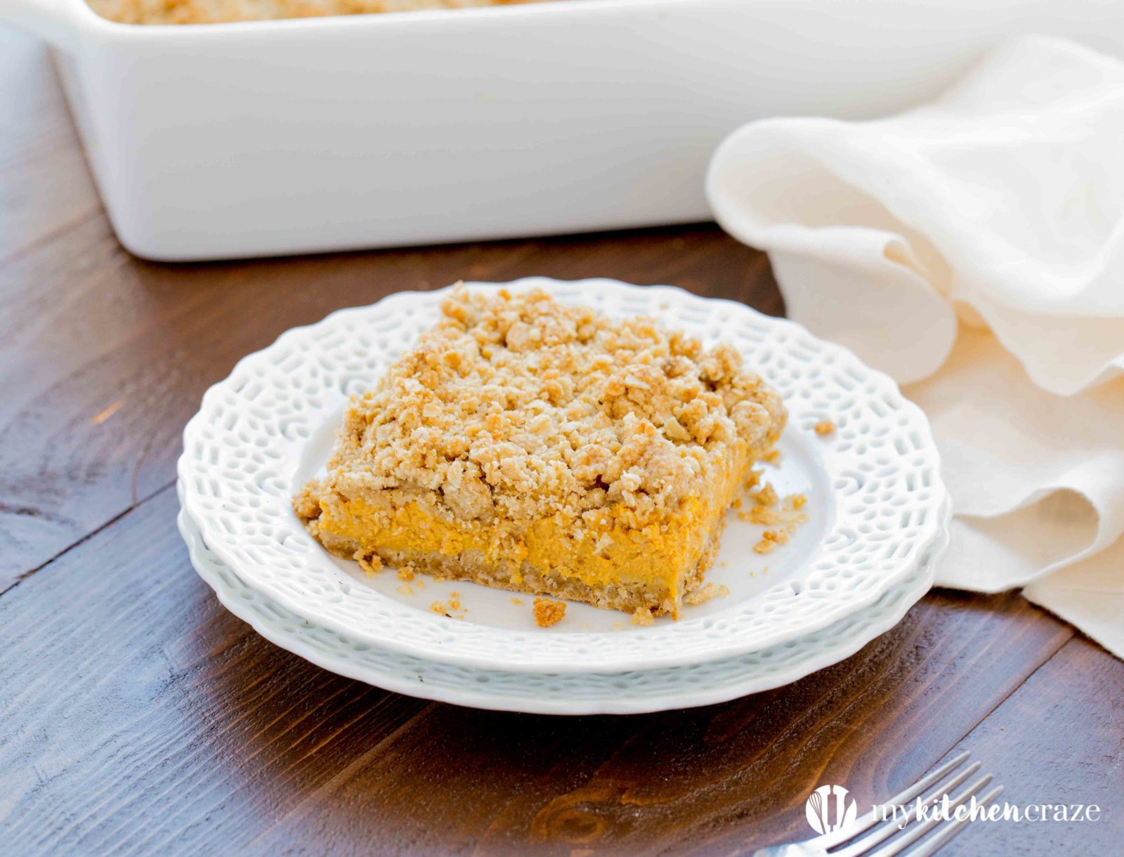 Pumpkin Cheesecake Bars ~ When you combine pumpkin & cheesecake together, what do you get? Delicious PUMPKIN CHEESECAKE BARS! These bars are creamy with a crunchy topping and crust. Yum!