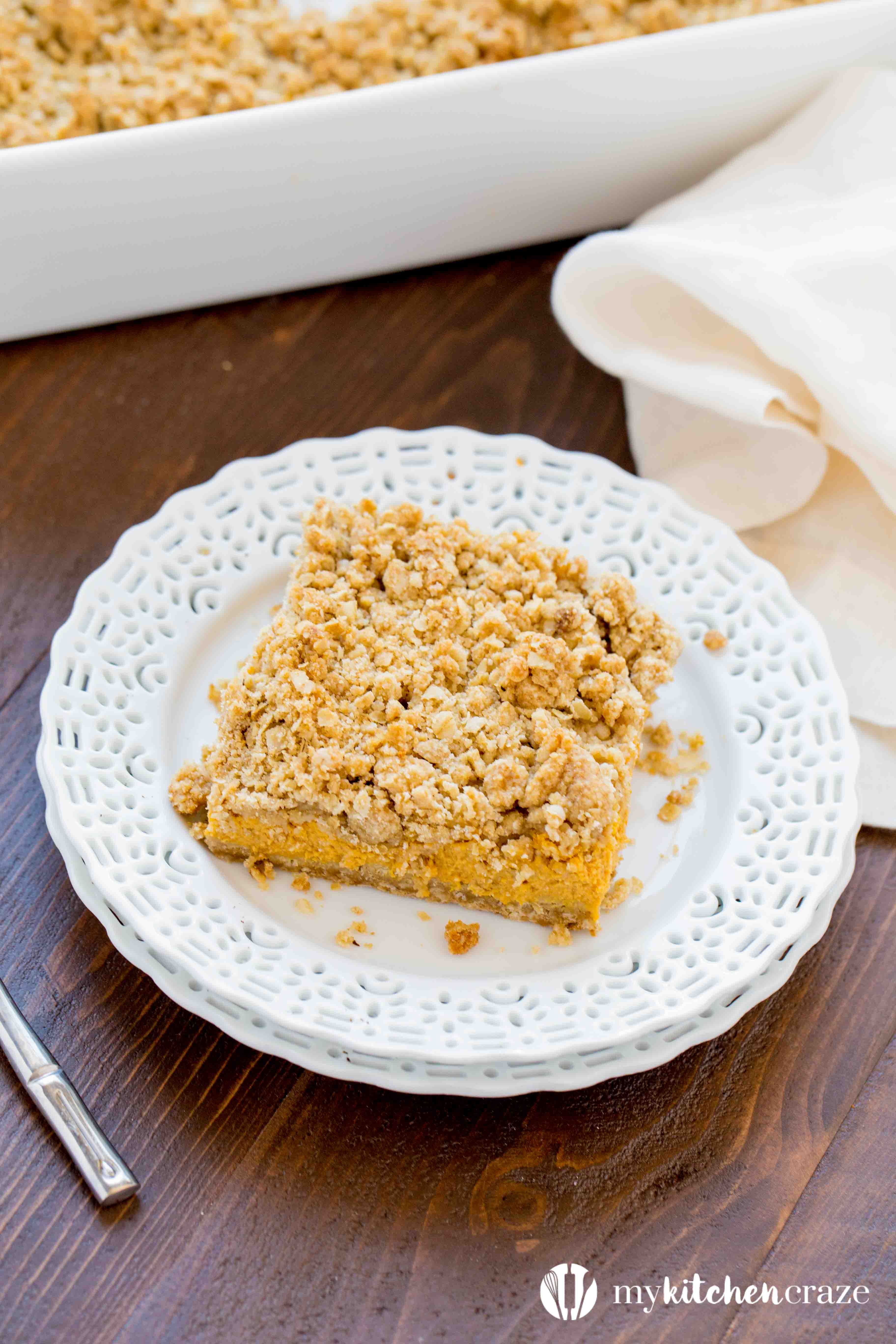 Pumpkin Cheesecake Bars ~ When you combine pumpkin & cheesecake together, what do you get? Delicious PUMPKIN CHEESECAKE BARS! These bars are creamy with a crunchy topping and crust. Yum!