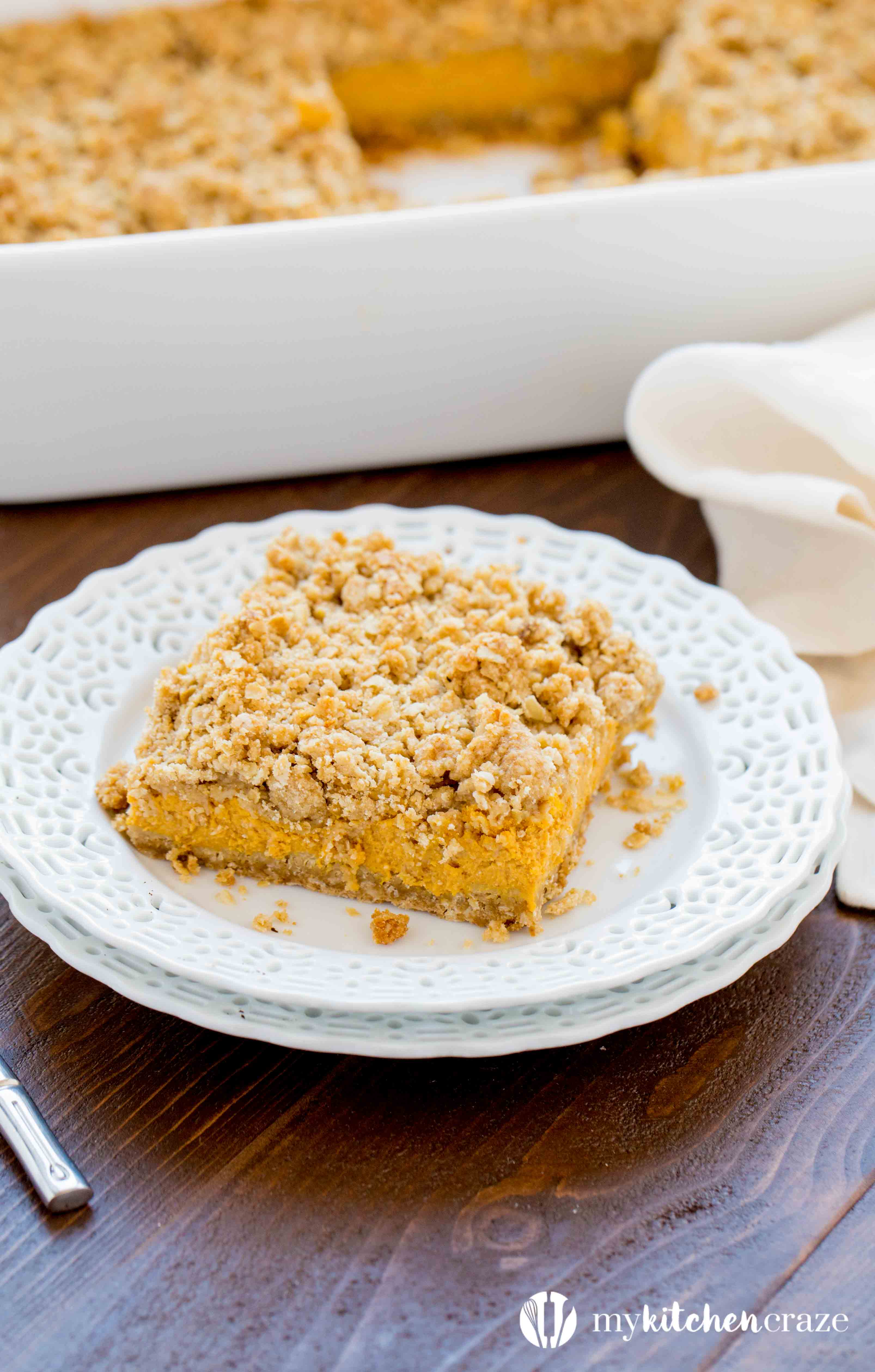 Pumpkin Cheesecake Bars ~ When you combine pumpkin & cheesecake together, what do you get? Delicious PUMPKIN CHEESECAKE BARS! These bars are creamy with a crunchy topping and crust. Yum!