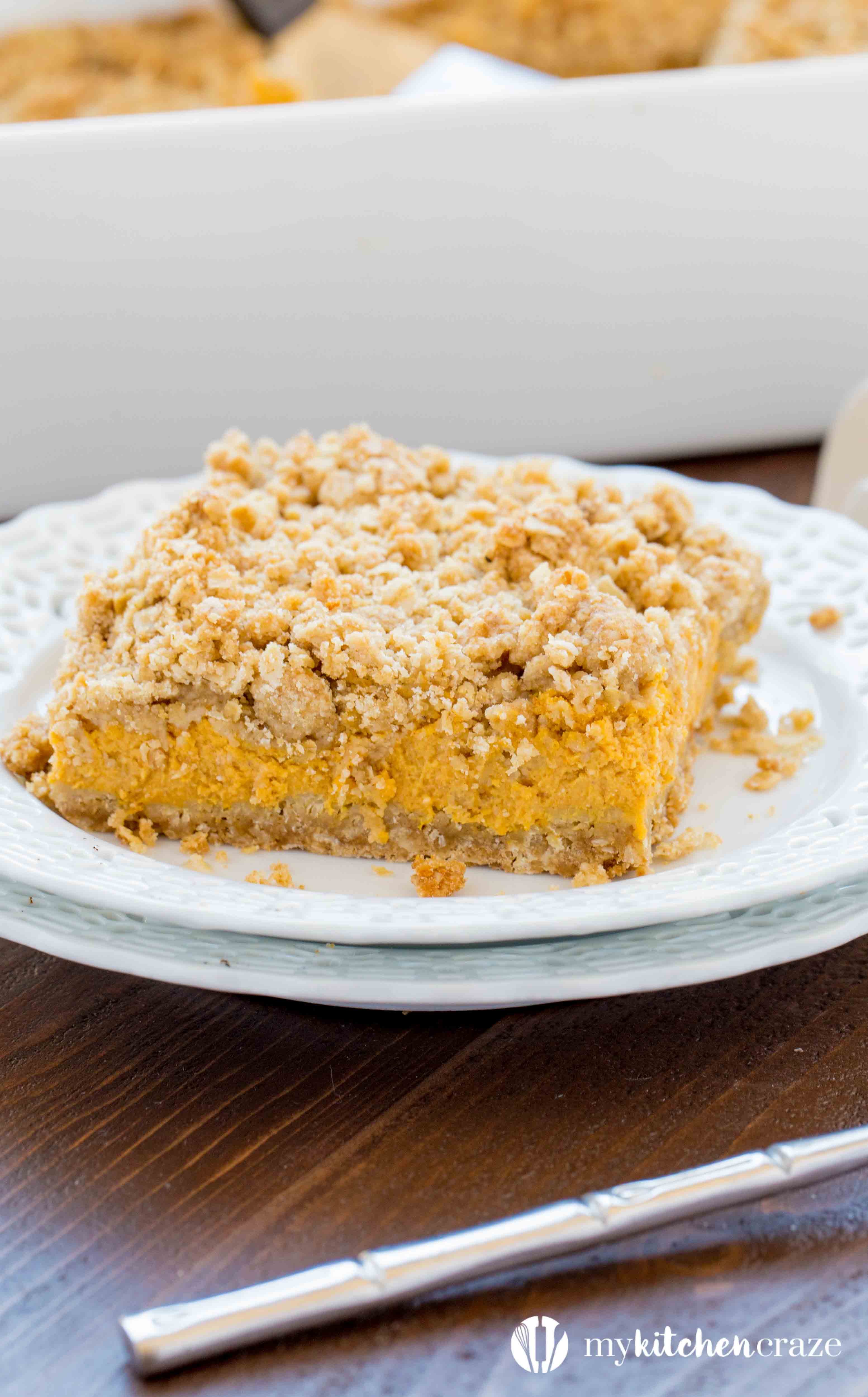 Pumpkin Cheesecake Bars ~ When you combine pumpkin & cheesecake together, what do you get? Delicious PUMPKIN CHEESECAKE BARS! These bars are creamy with a crunchy topping and crust. Yum!