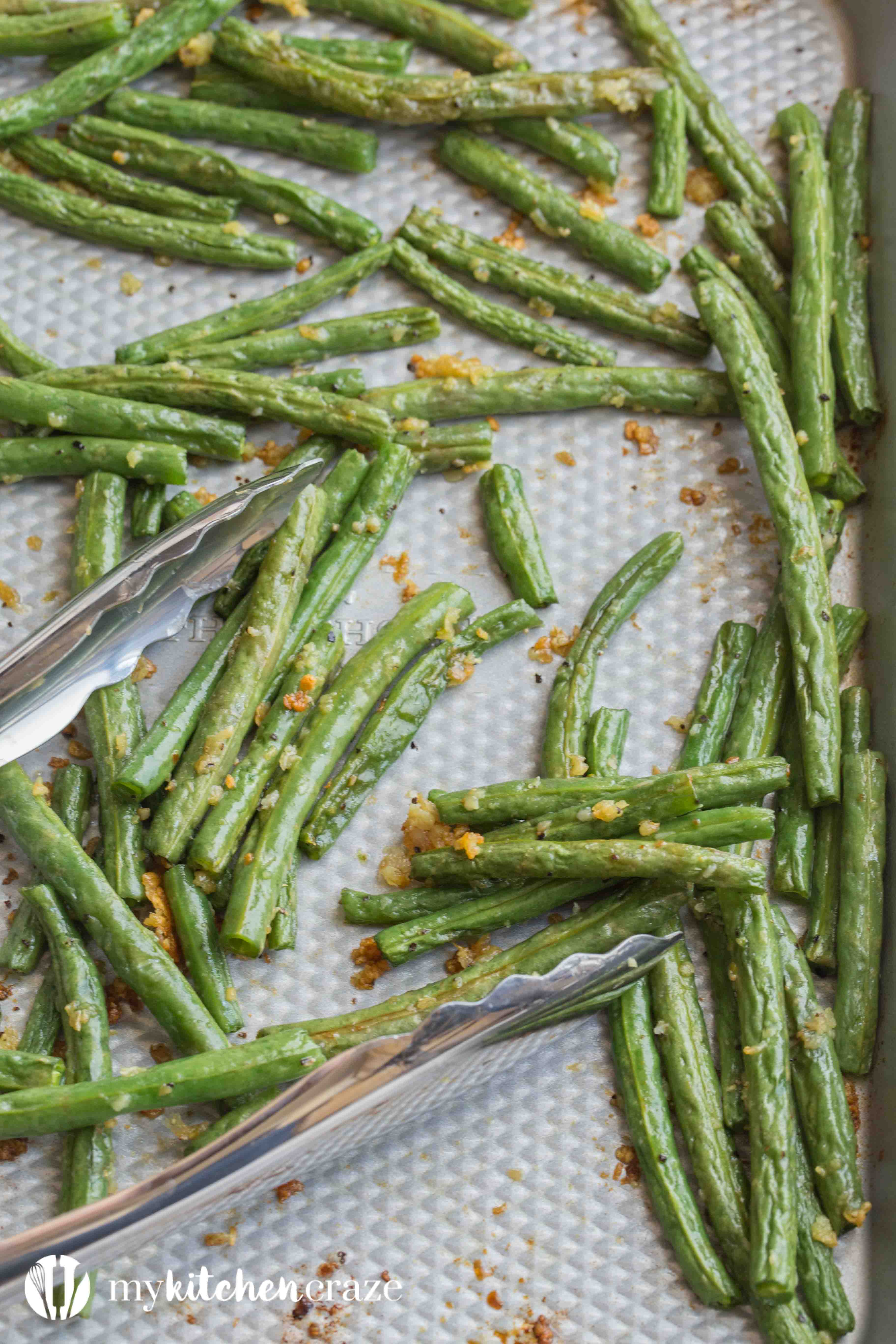 Baked Garlic Green Beans are a simple and delicious side dish that will compliment any main entree. Crunchy green beans and roasted garlic, make this one easy yummy side!