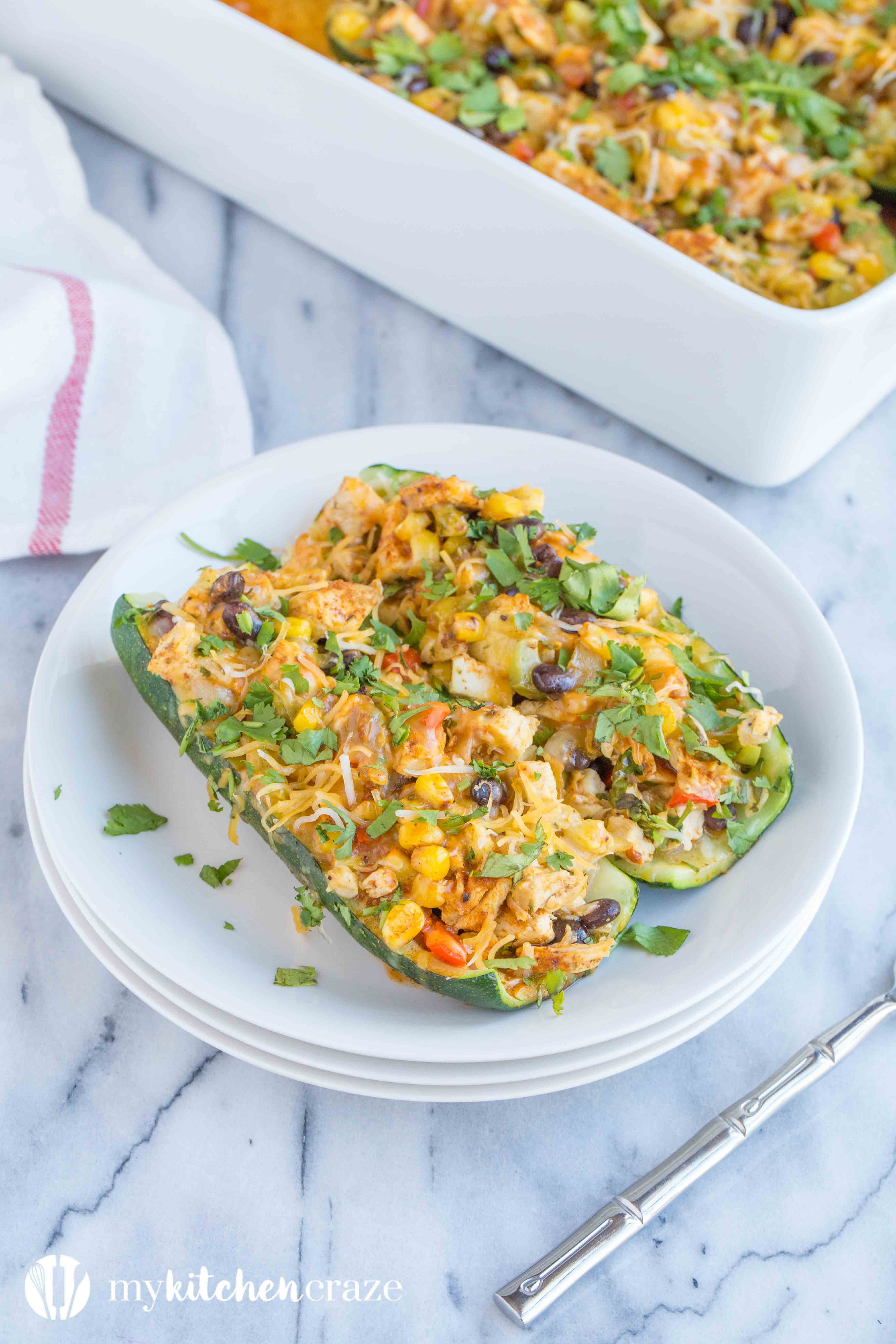 Chicken Enchilada Zucchini Boats are filled with all the same delicious flavors as regular enchiladas, but are healthier! Loaded with tons of veggies and yummy flavors, these enchiladas are great for dinner!