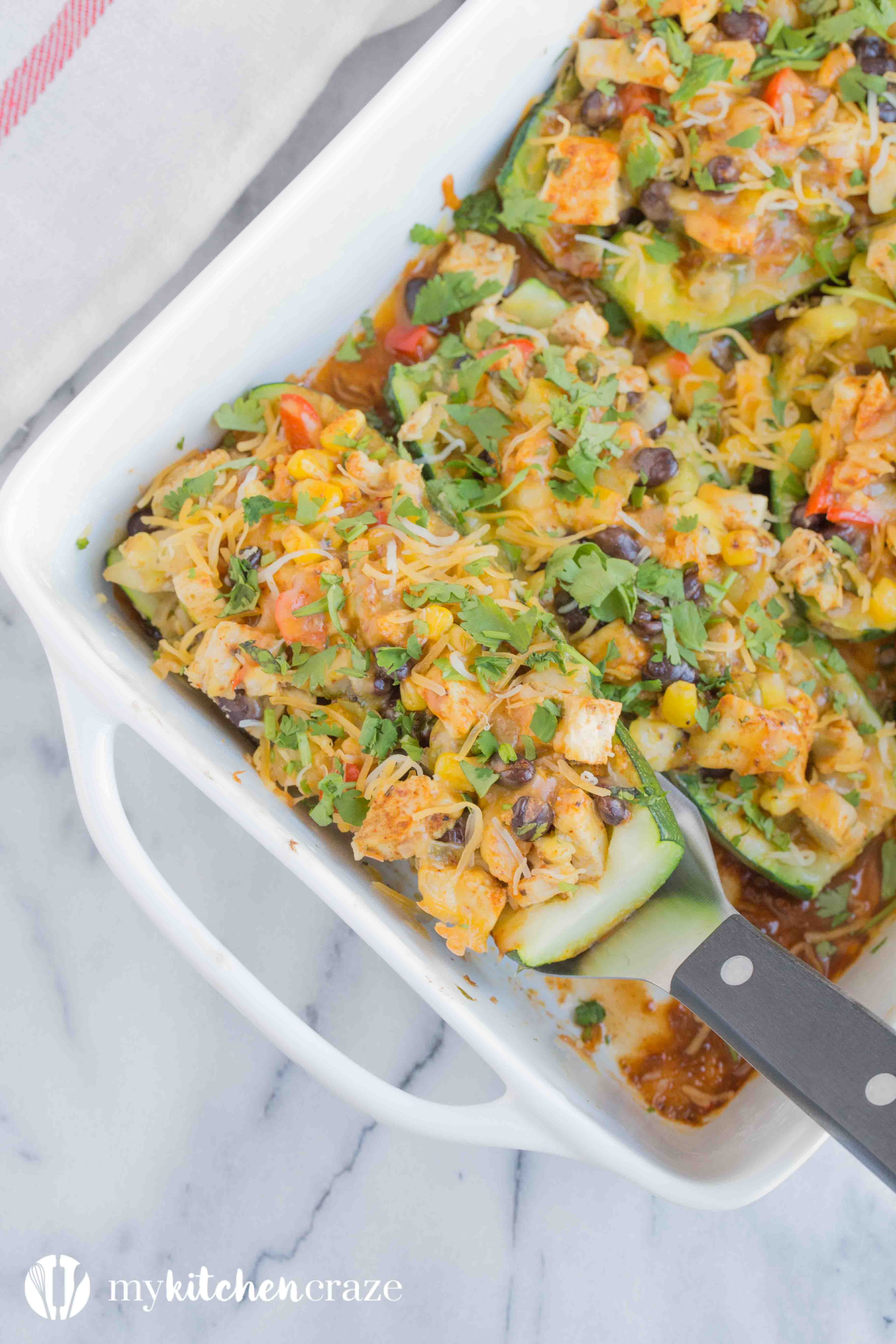 Chicken Enchilada Zucchini Boats are filled with all the same delicious flavors as regular enchiladas, but are healthier! Loaded with tons of veggies and yummy flavors, these enchiladas are great for dinner!