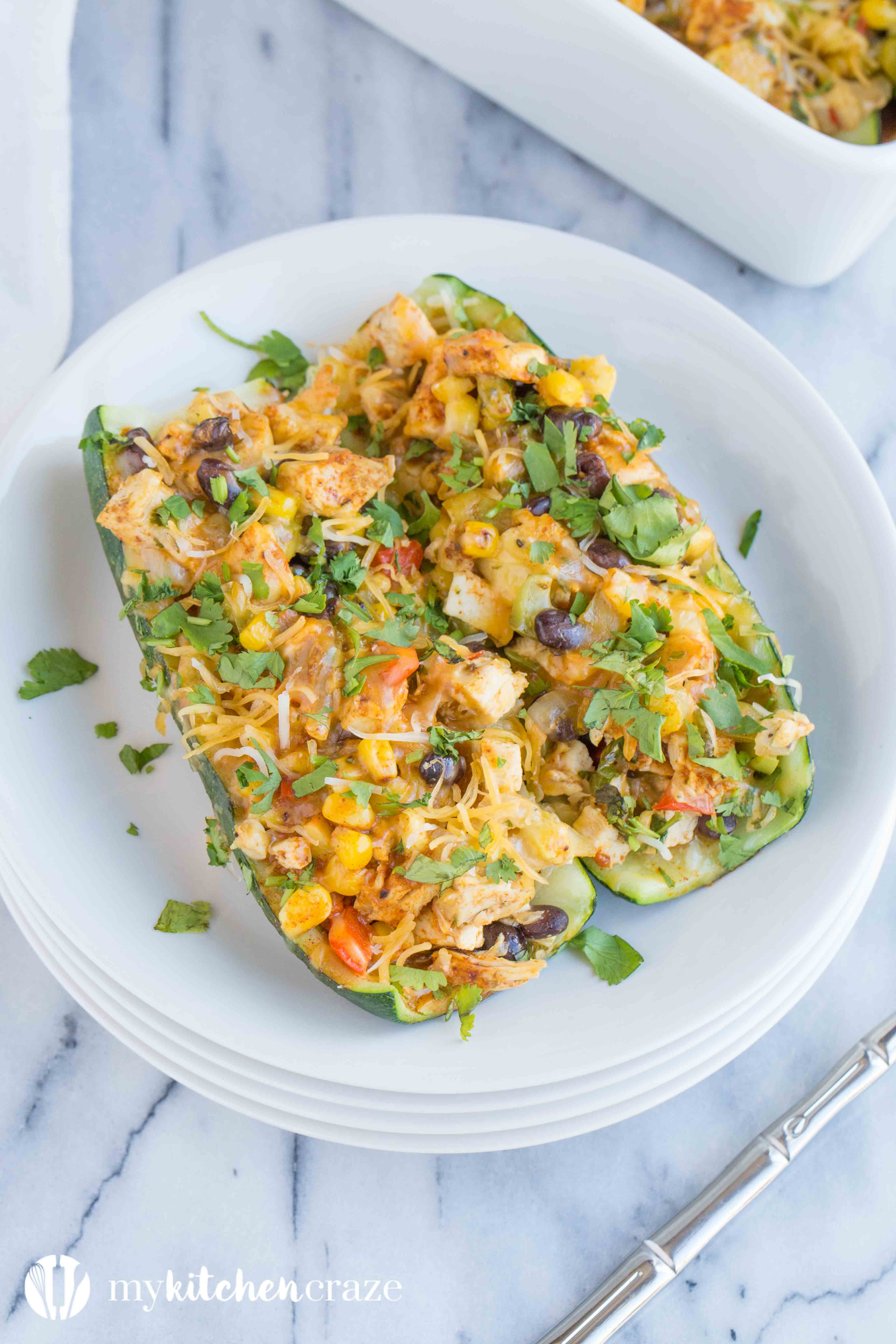 Chicken Enchilada Zucchini Boats are filled with all the same delicious flavors as regular enchiladas, but are healthier! Loaded with tons of veggies and yummy flavors, these enchiladas are great for dinner!