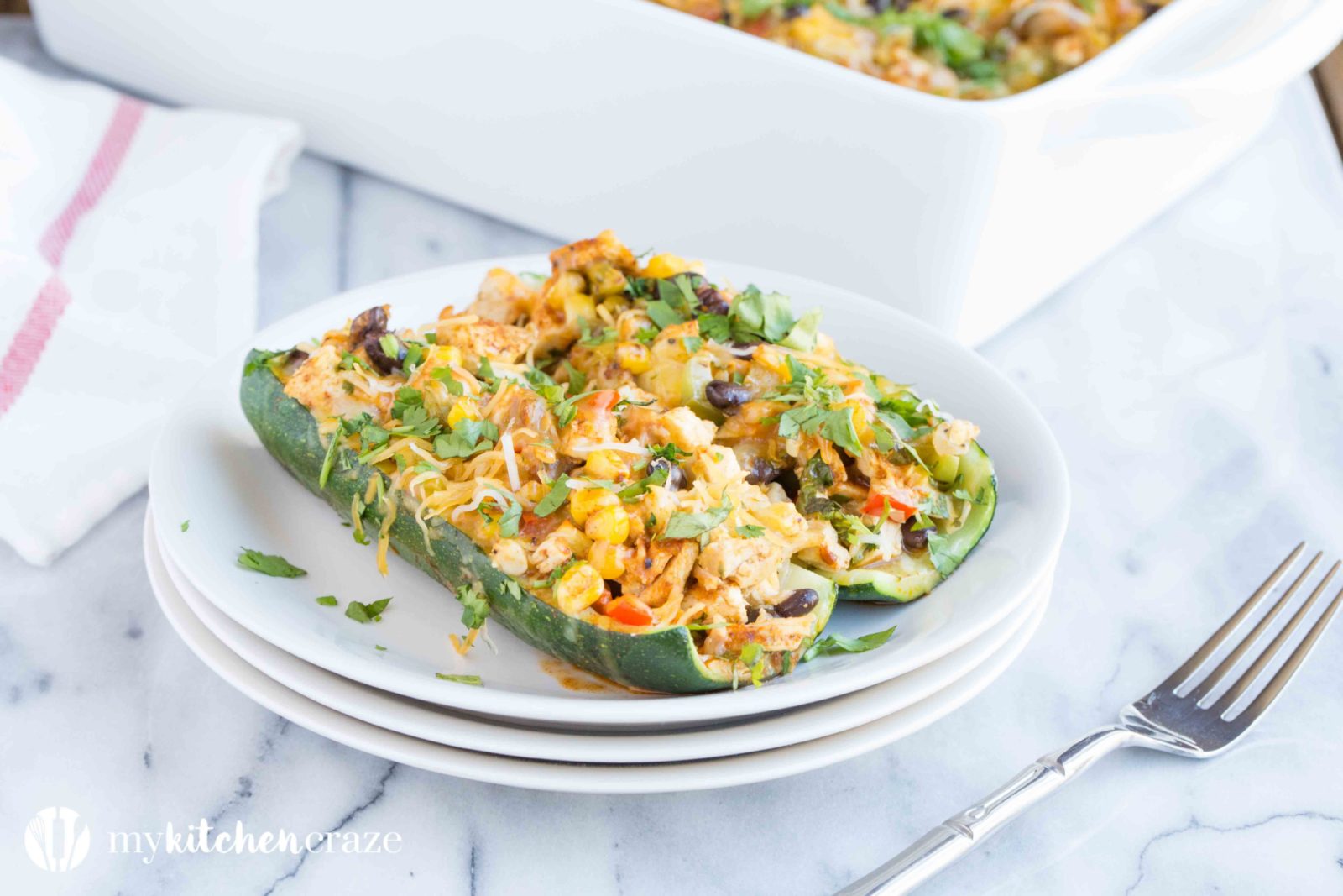 Chicken Enchilada Zucchini Boats are filled with all the same delicious flavors as regular enchiladas, but are healthier! Loaded with tons of veggies and yummy flavors, these enchiladas are great for dinner!