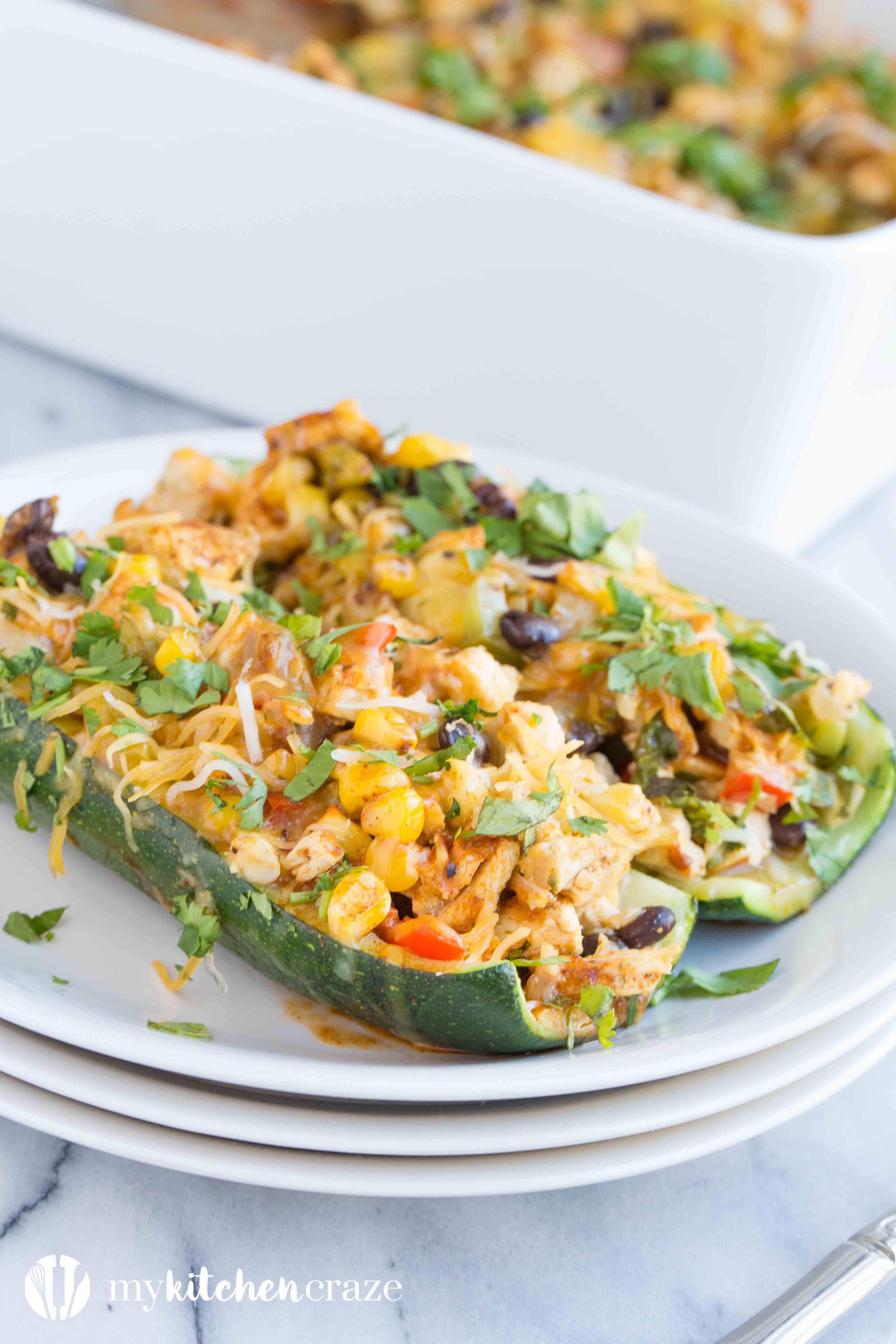 Chicken Enchilada Zucchini Boats are filled with all the same delicious flavors as regular enchiladas, but are healthier! Loaded with tons of veggies and yummy flavors, these enchiladas are great for dinner!