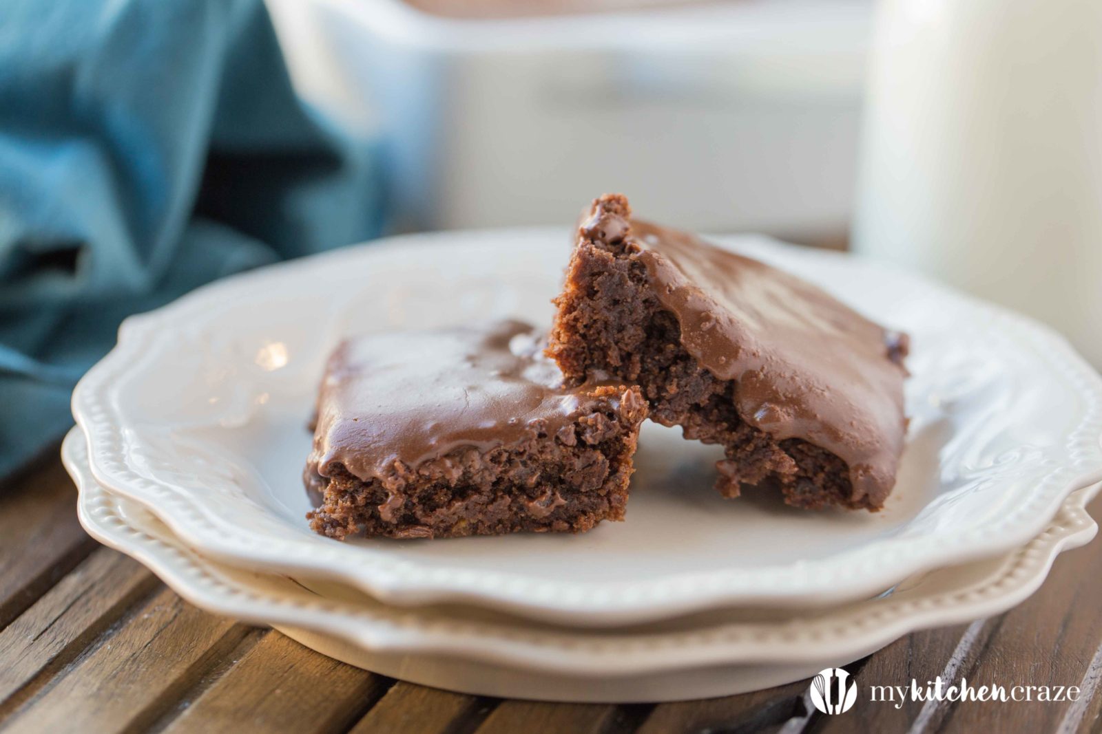 Frosted Brownies are a must have recipe! Brownies that are moist, delicious and the frosting takes these brownies to a whole new level. Grab that glass of milk because you'll want it with a slice of these yummy Frosted Brownies!