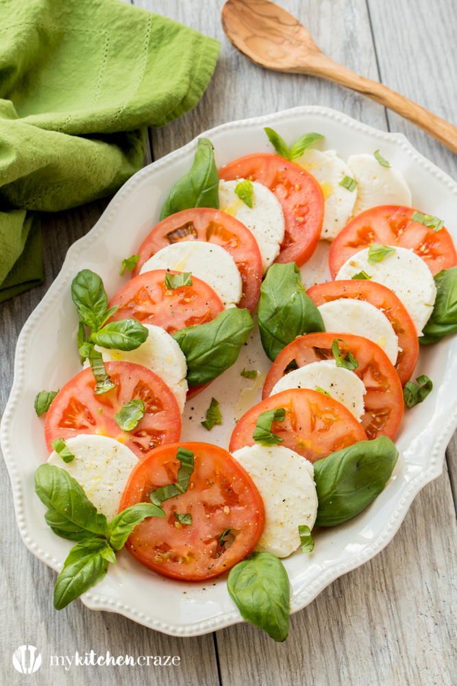 Caprese Salad ~ Tomatoes, fresh mozzarella and basil drizzled with a sweet balsamic reduction and olive oil. What could be better and easier?