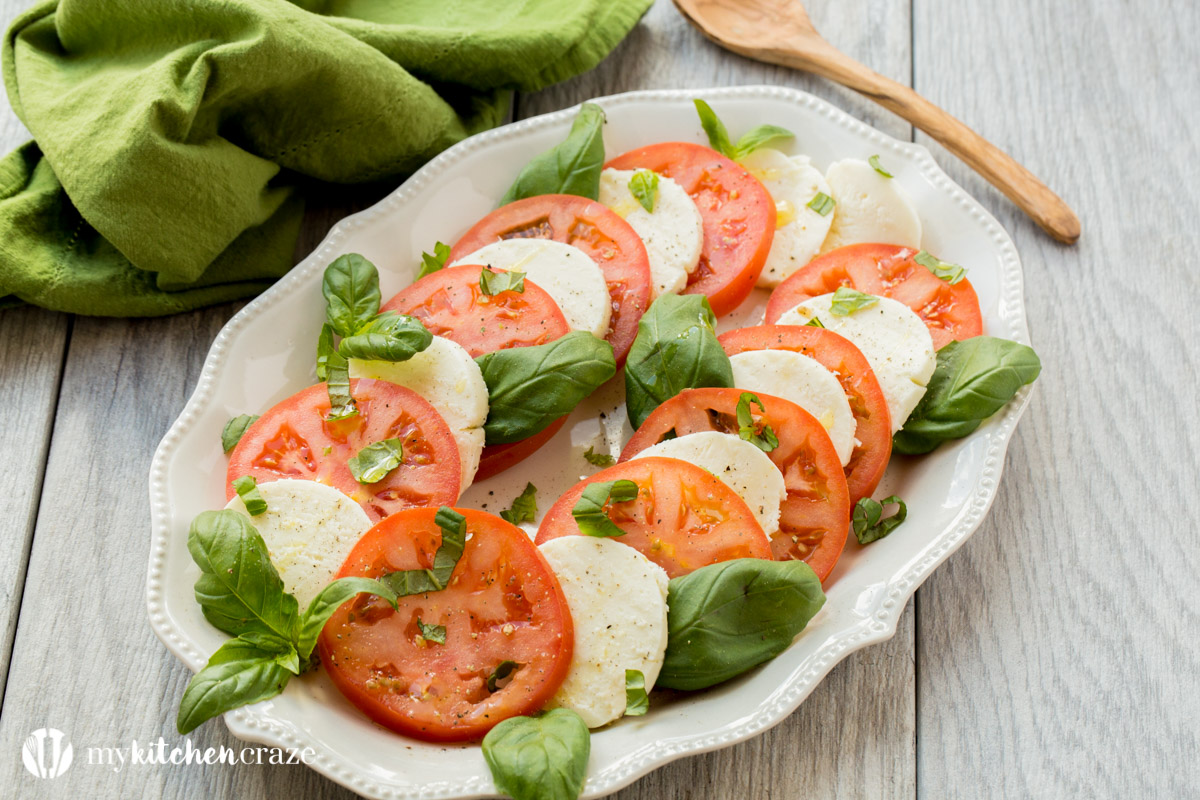 Caprese Salad ~ Tomatoes, fresh mozzarella and basil drizzled with a sweet balsamic reduction and olive oil. What could be better and easier?