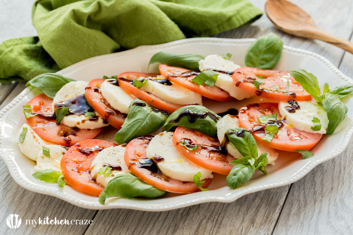 Caprese Salad ~ Tomatoes, fresh mozzarella and basil drizzled with a sweet balsamic reduction and olive oil. What could be better and easier?