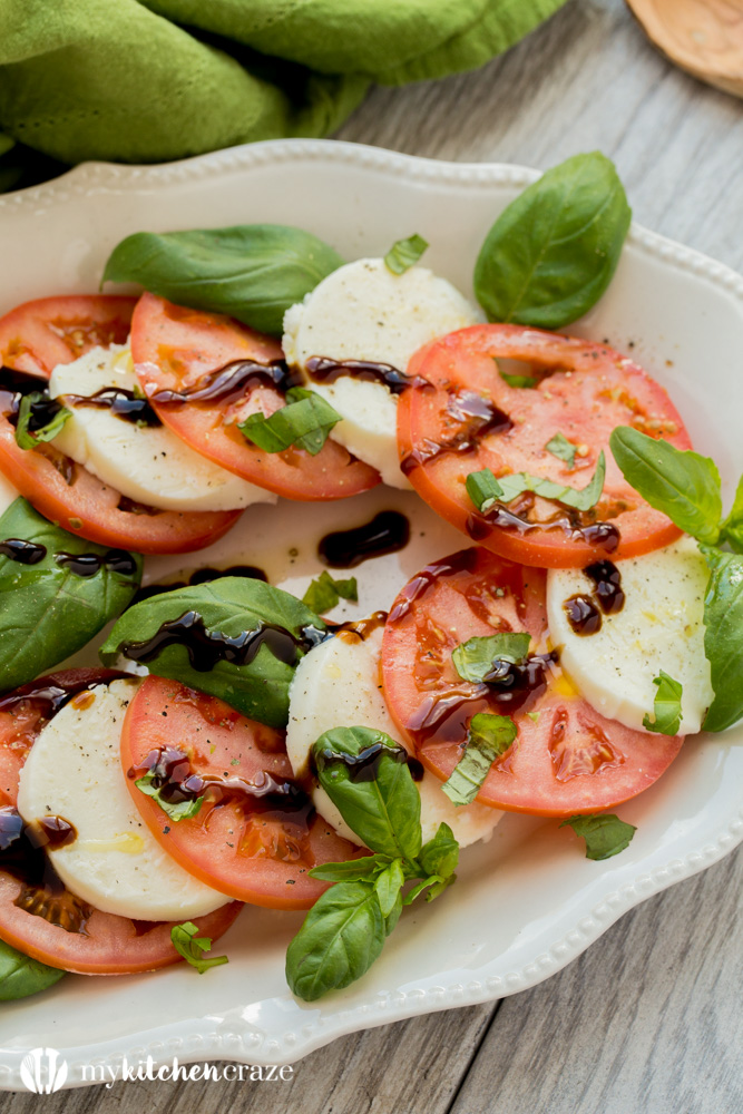 Caprese Salad ~ Tomatoes, fresh mozzarella and basil drizzled with a sweet balsamic reduction and olive oil. What could be better and easier?