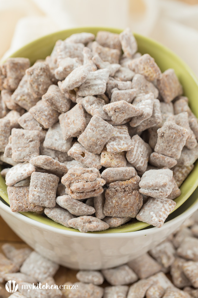 Muddy Buddies ~ crunchy cereal coated with chocolate, peanut butter and powered sugar. This is one kid approved snack and the best news is it takes minutes to throw together!