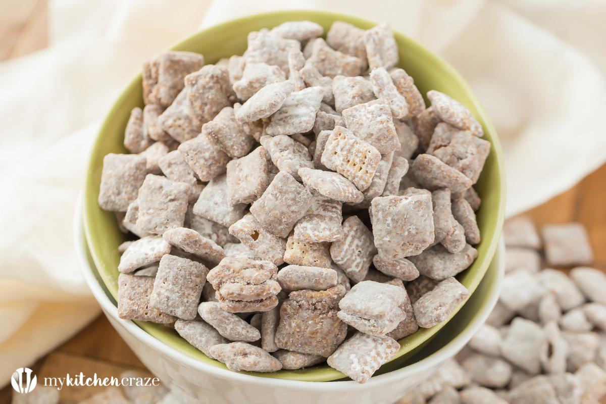 Muddy Buddies ~ crunchy cereal coated with chocolate, peanut butter and powered sugar. This is one kid approved snack and the best news is it takes minutes to throw together!